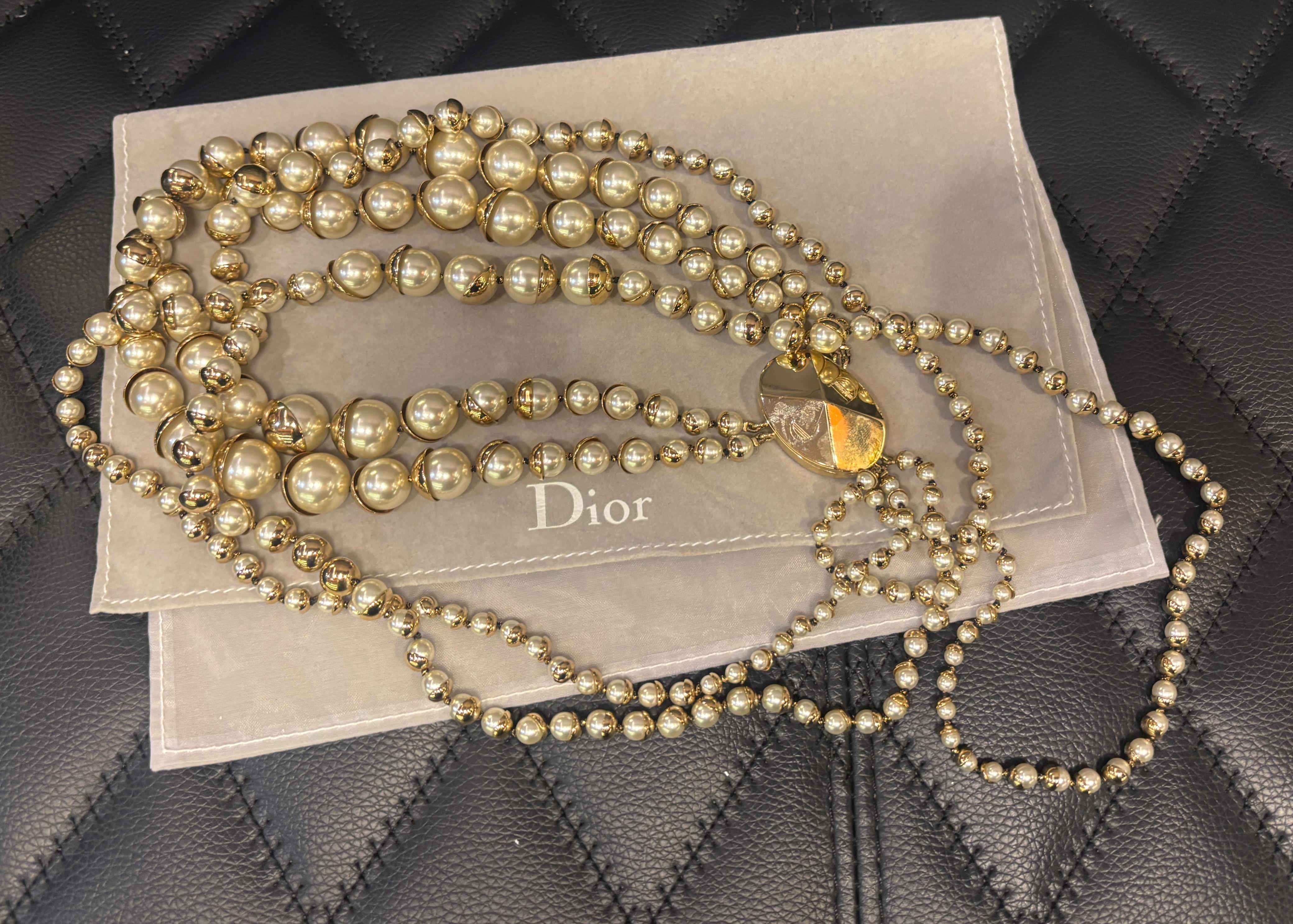 Vintage Dior layered pearl necklace. Very beautiful vintage piece with intricate gold hardware detail encapsulating the pearls. Magnetic clasp. Can be worn layered or loosely like the pictures. Minor scuffs on the faux pearls and hardware. Slight