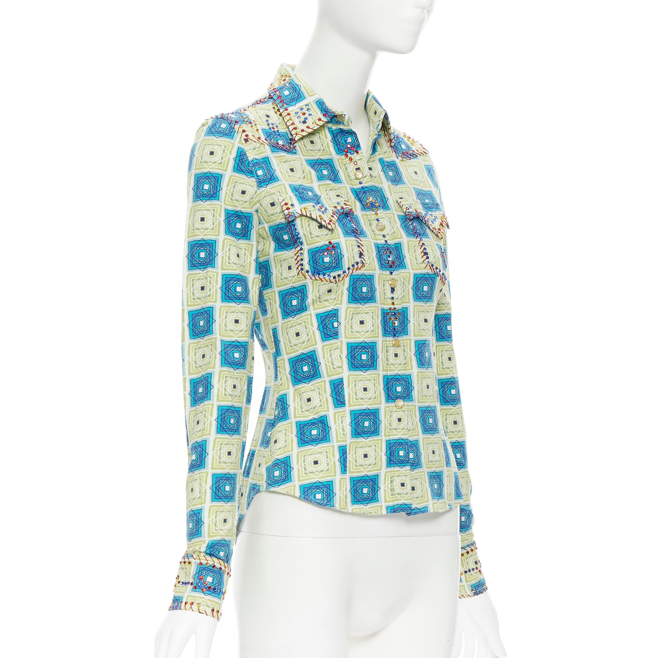 vintage CHRISTIAN DIOR GALLIANO green geometric crystal bordered slim shirt FR36 
Reference: TGAS/B00723 
Brand: Christian Dior 
Designer: John Galliano 
Material: Cotton 
Color: Green 
Pattern: Geometri 
Closure: Snap 
Extra Detail: Red