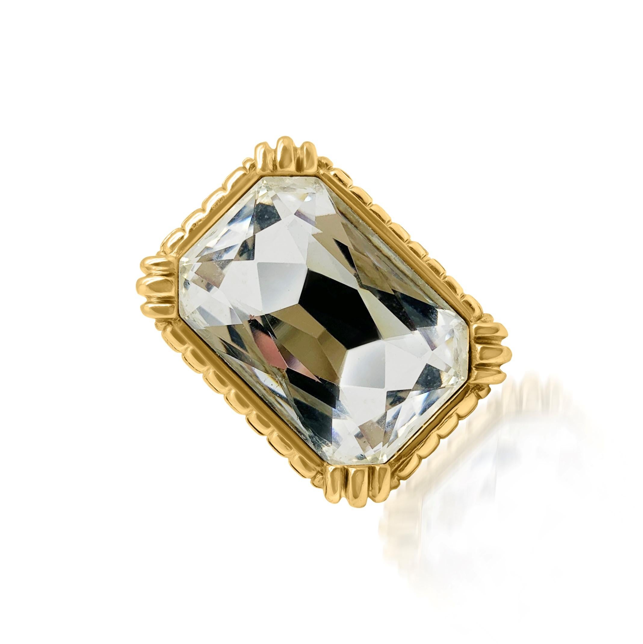 A spectacular Vintage Dior Crystal Ring. Crafted in gold plated metal and Swarovski crystal. Featuring a weighty gold plated high mount shank set with the most mesmerising and glamourous oversize crystal headlamp stone. In very good vintage