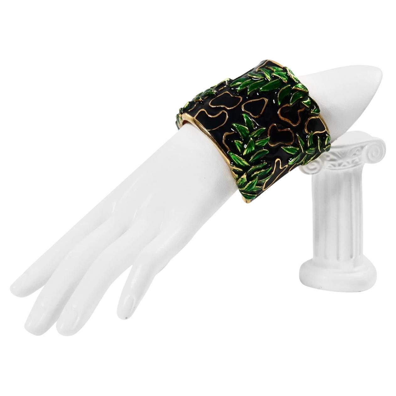  This gorgeous Vintage Christian Dior Cuff bracelet is fully covered in green, black, and gold enamel, with see-through cloisonné designs featuring bamboo leaves on a black background.  This is during the Gianfranco Ferre design era of Christian