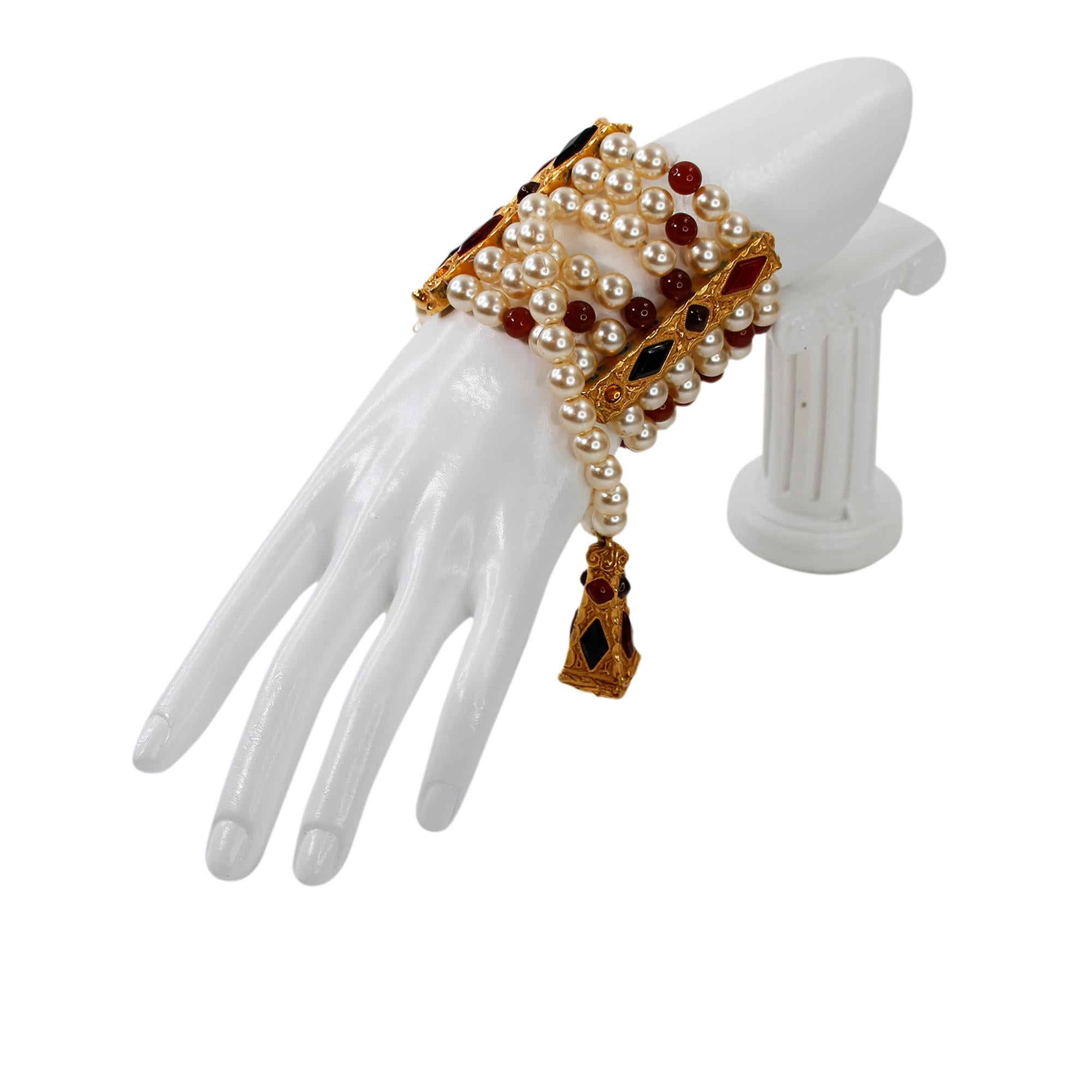 Vintage Christian Dior Gold and  Faux Pearl Dangling Bracelet Circa 1980s. Various Red Beads and Varying Shades of Red Gripoix on this 6-Strand Bracelet with One Long Draping Strand that Hangs to the Side when on.  Stunning!!  This is a Couture