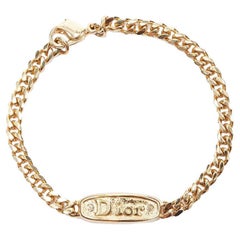 CHRISTIAN DIOR Bracelet étiquette vintage à logo en cristal doré avec logo vintage