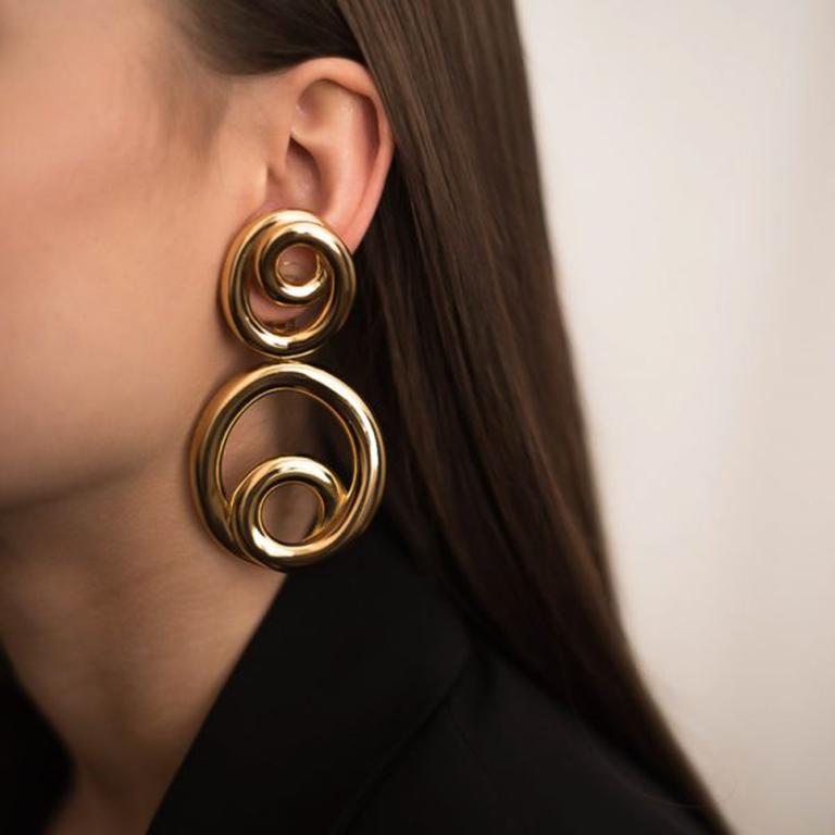 Stunning dramatic Vintage Dior Hoop Earrings. Truly exceptional statement earrings from the House of Dior during the 90s. Rare to find earrings of this scale from Dior during the 90s. Made in high quality, gold plated metal, the workmanship is