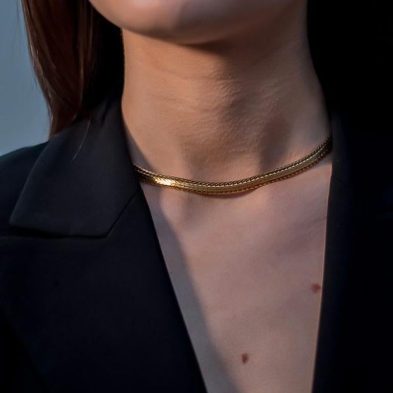 A true style staple. A Vintage Dior Herringbone Collar from the 1980s. Featuring gold plated metal and herringbone style chain with edging. Measuring approx. 38.5cm and in very good vintage condition. Signed on the reverse. Wear alone or stacked.