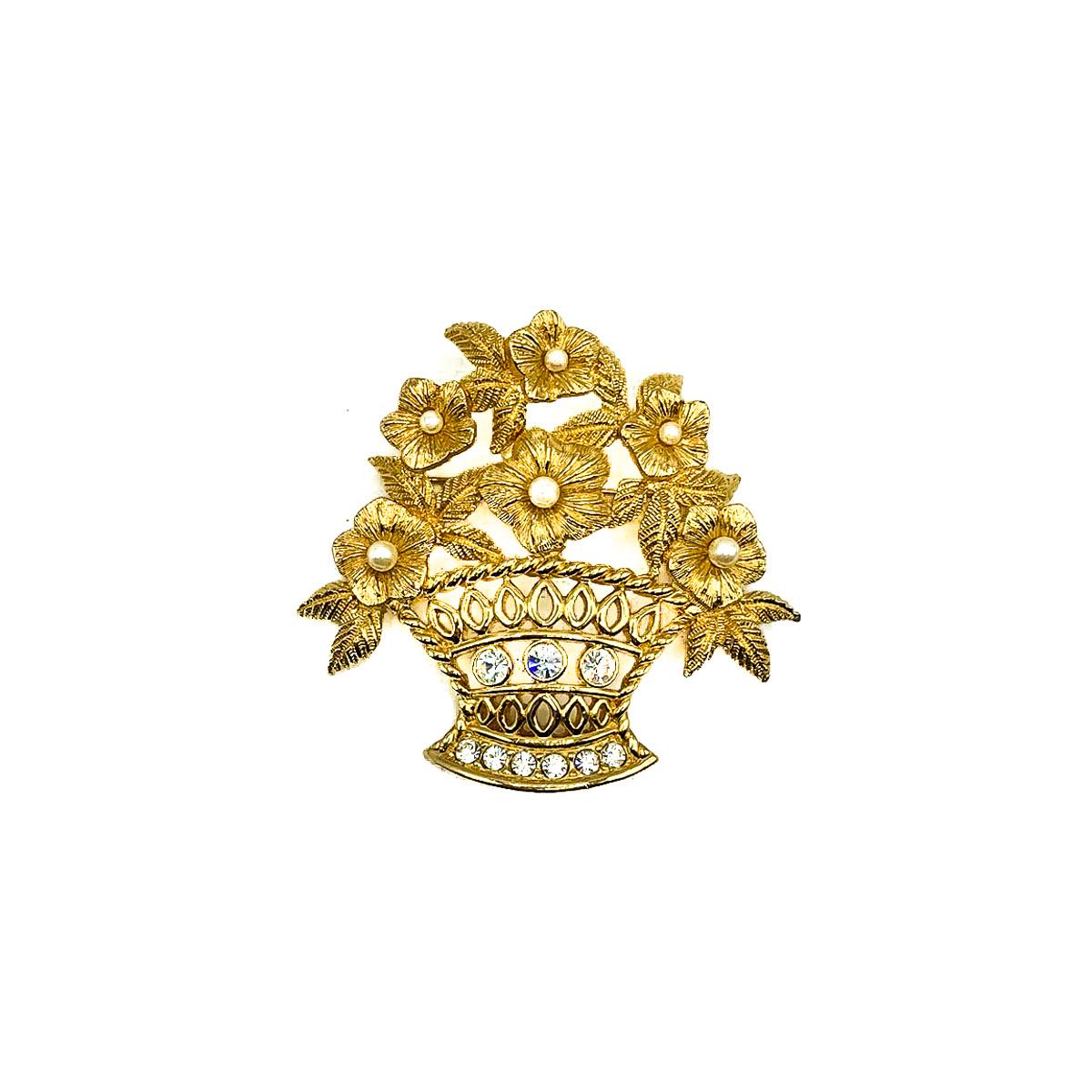 A Vintage Dior Flower Brooch. Crafted in gold plated metal and set with crystals and simulated pearls. In very good vintage condition. 6cms long. Signed. A beautiful statement brooch from the House of Dior that is so very classy and chic. Should you