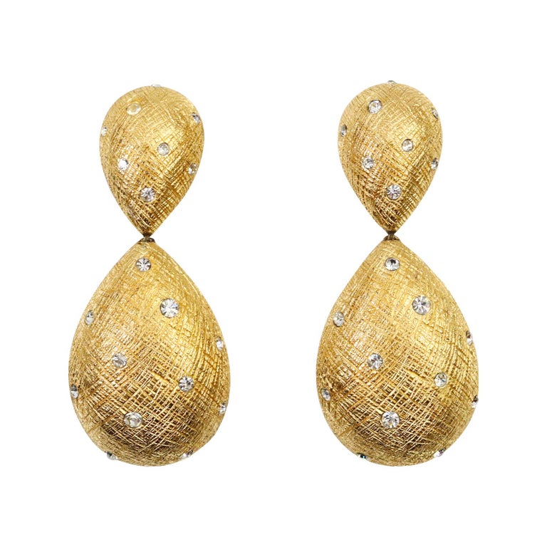 Vintage Christian Dior Gold Tear Drop Crystal Earrings Circa 1980s. Classic Dior earrings with texture with inlaid crystals.  Always looks good and elevates your outfit. Clip On. There is a necklace on site that matches.  These wto together would be