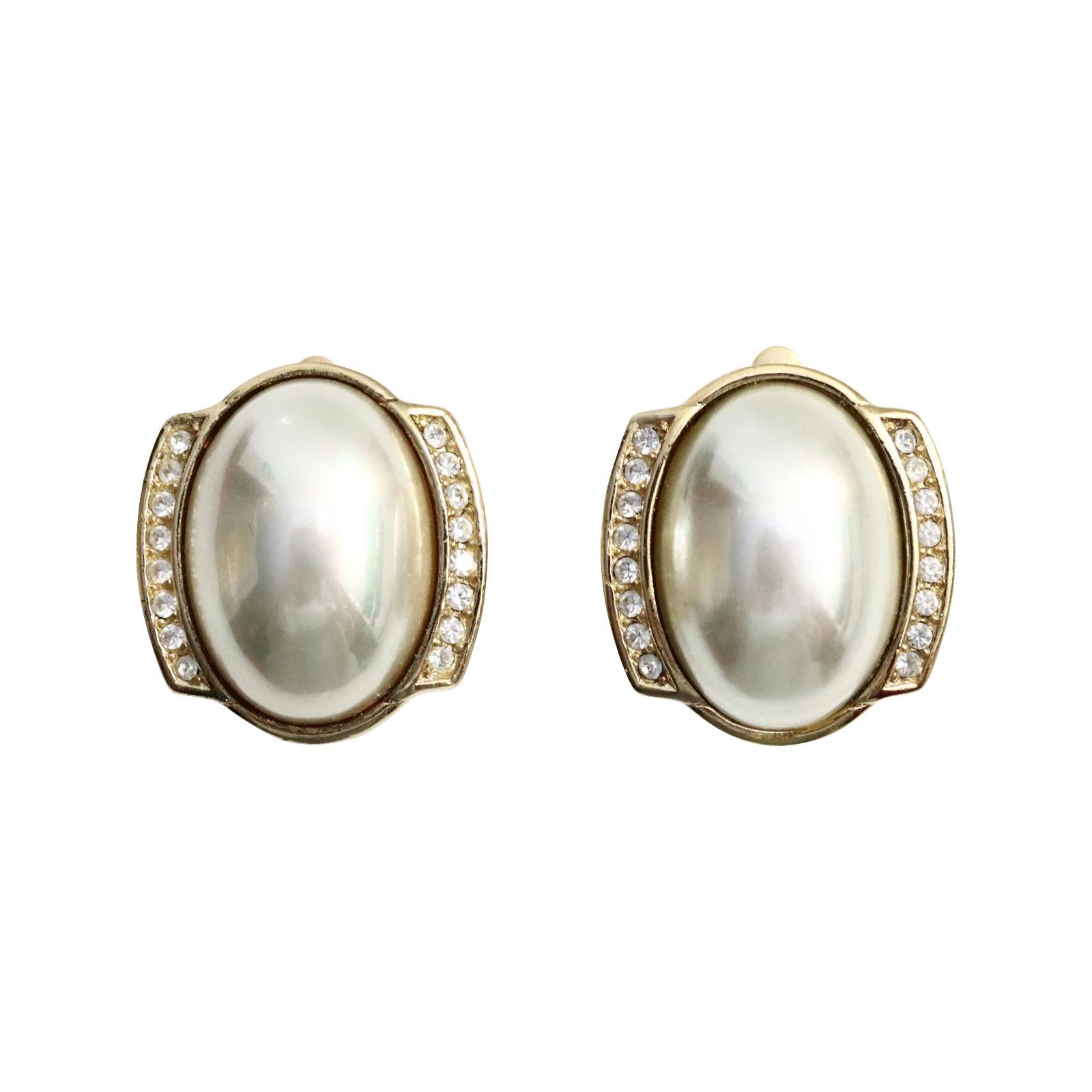 Vintage Christian Dior Gold Tone Faux Pearl Earrings Circa 1980s. These are always great to have in your arsenal.  They can be dressed up or down.  They are classic Faux pearls surrounded by diamante.  They will always be in style no matter what the