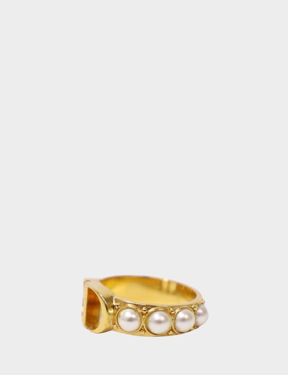 Elevate your jewelry collection with this exquisite Christian Dior gold-tone ring. Featuring the iconic 