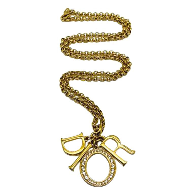 An uber cool Vintage Christian Dior DIOR Charm Necklace. Increasingly hard to track down, this is the grande or largest of these iconic D I O R letter necklaces created by the House of Dior during the late 80s early 90s. The necklace features four