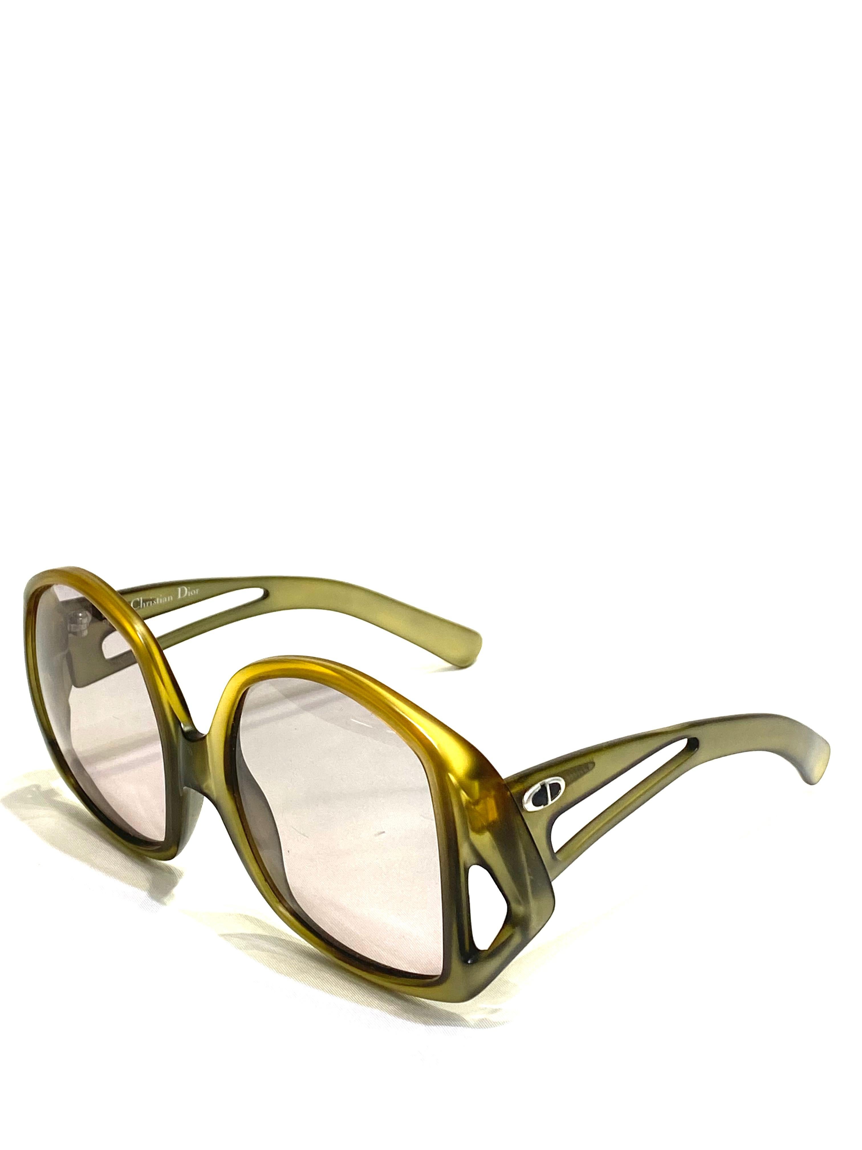 Product details:

Circa 1970.
Featuring yellow/ green matte finish frames with round square lens, silver tone CD logo on each sides of the temple.
Signed Christian Dior.
Made in Germany.
