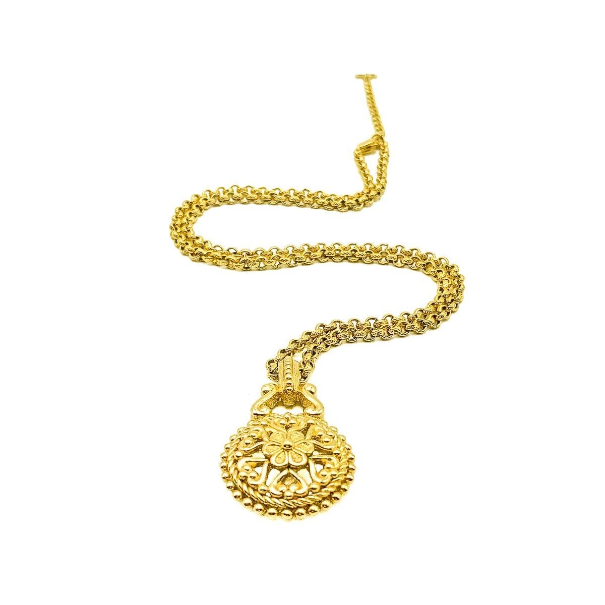 A Vintage Dior Hearts & Flowers Chain. An ornate chases belcher style chain with pendant depicting a central flower surrounded by a circle of hearts. Crafted in gold plated metal. Very good vintage condition, signed, Adjustable 51-56cms. A