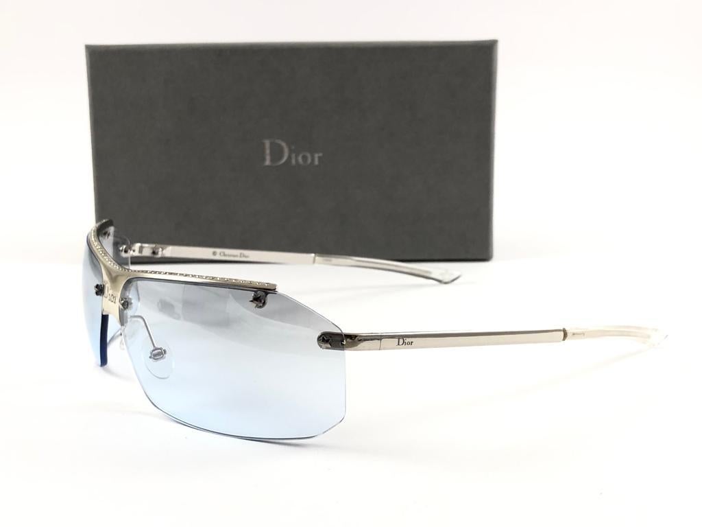 Vintage Christian Dior HIT silver with light blue lenses Wrap Sunglasses Fall 2000 by Galliano.

Made in Austria.
 
This piece show minor sign of wear due to  storage.

Front : 15.5 cms

Lens Height : 3.6 cms

Lens Width : 15.5 cms 
