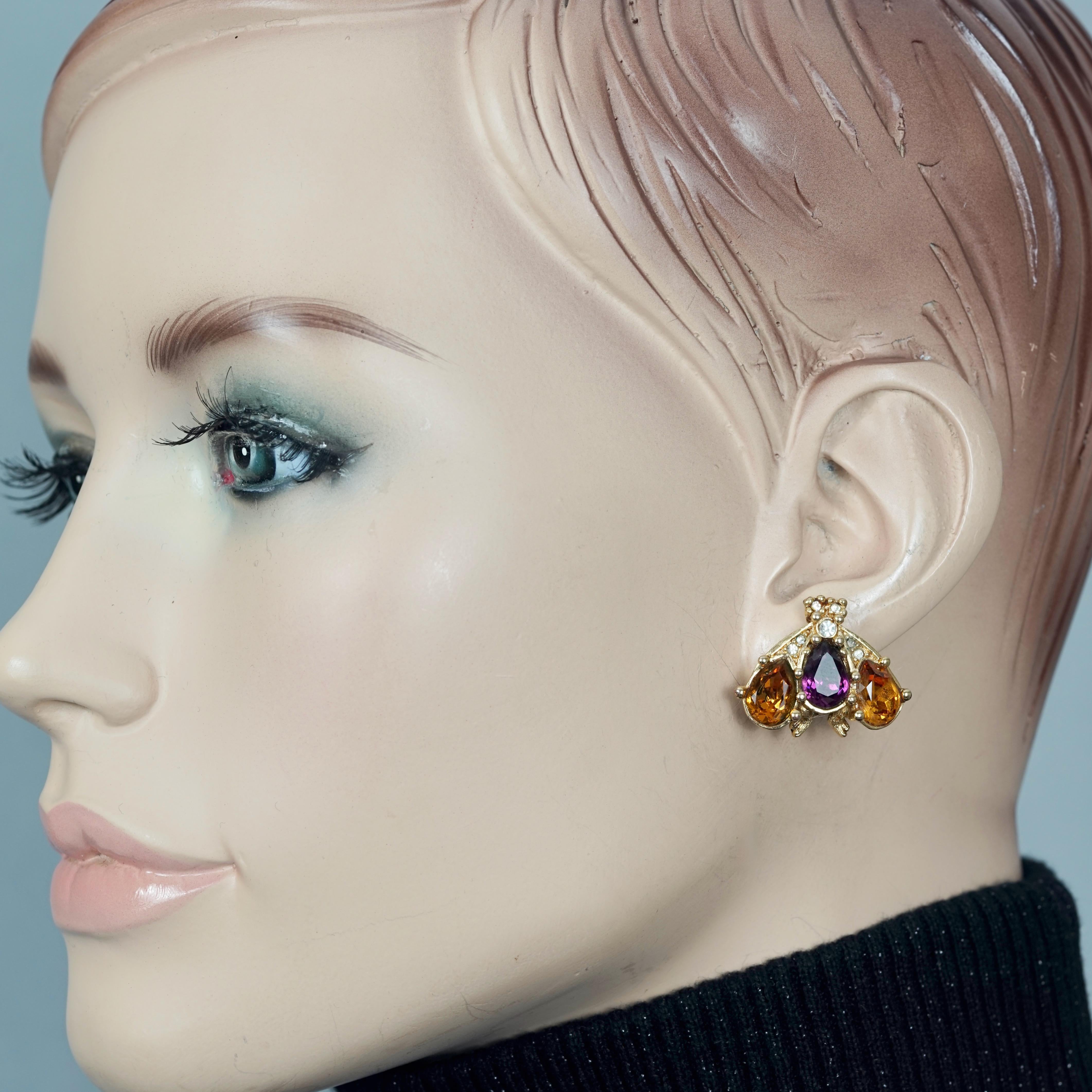 Vintage CHRISTIAN DIOR Jewelled Bumble Bee Earrings

Measurements:
Height: 0.82 inch (2.1 cm) 
Width: 1.02 inches (2.6 cm)
Weight per Earring: 7 grams

Features:
- 100% Authentic CHRISTIAN DIOR Limited Edition.
- Jewelled bumble bee earrings.
-