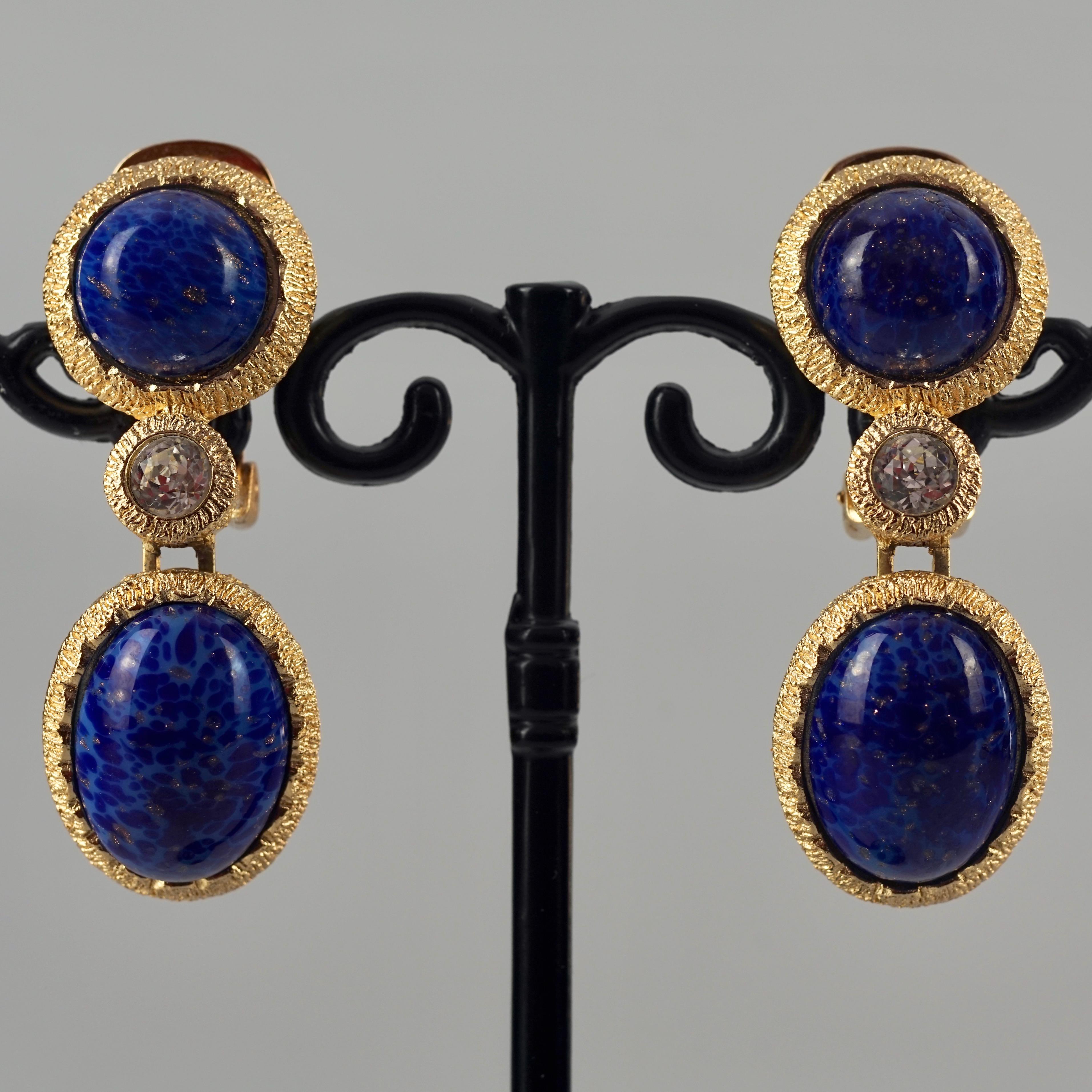 Vintage CHRISTIAN DIOR Lapis Lazuli Gilt Dangling Earrings

Measurements:
Height: 1.77 inches (4.5 cm)
Width: 0.70 inch (1.8 cm)
Weight per Earring: 17 grams

Features:
- 100% Authentic CHRISTIAN DIOR.
- Textured gilt dangling earrings with lapis