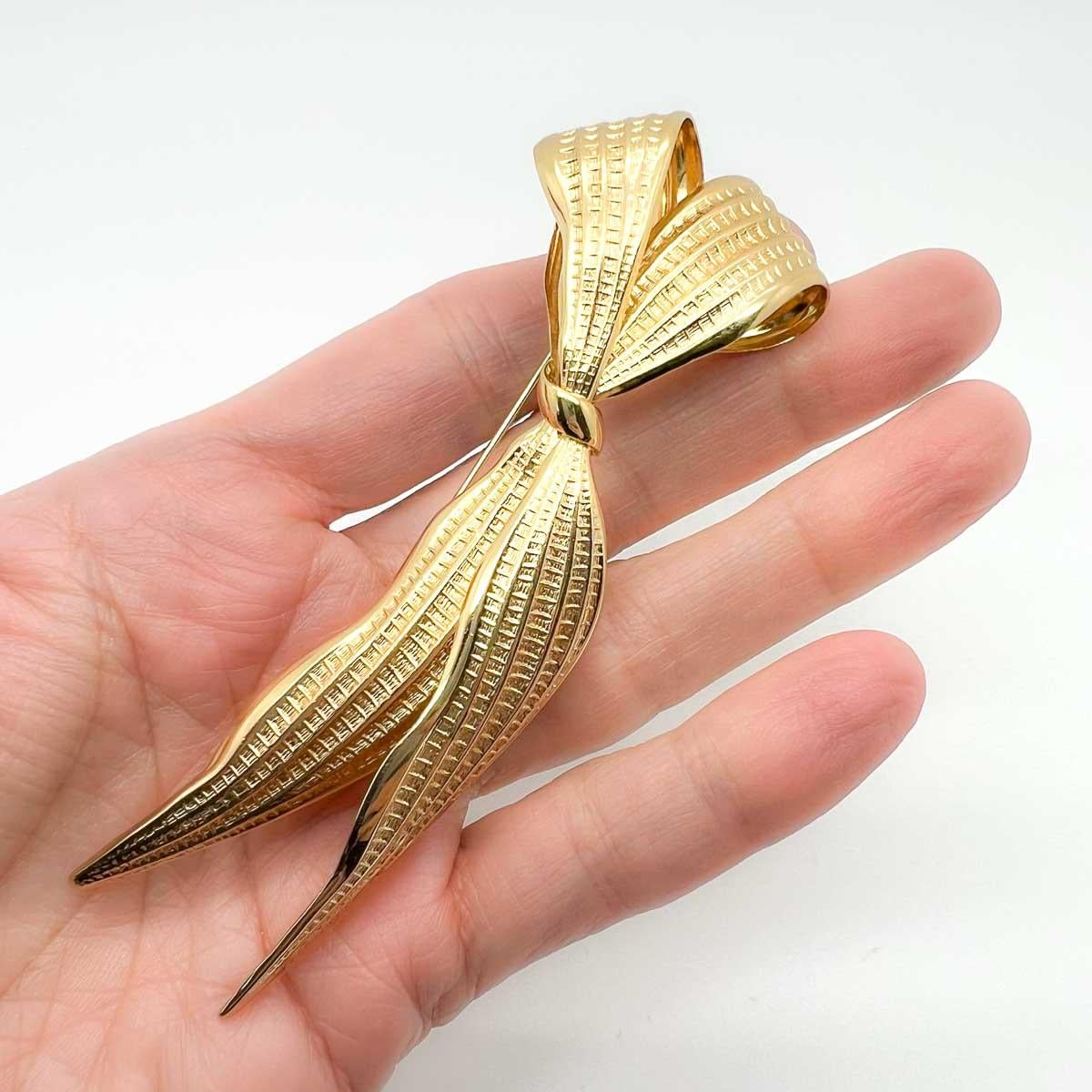 A fabulous elongated vintage Dior Bow brooch. With an open three-dimensional design and striking scale this a beautiful piece to adorn your lapel with. Timeless style and charm abound with this archive piece from the House of Dior.
With archive