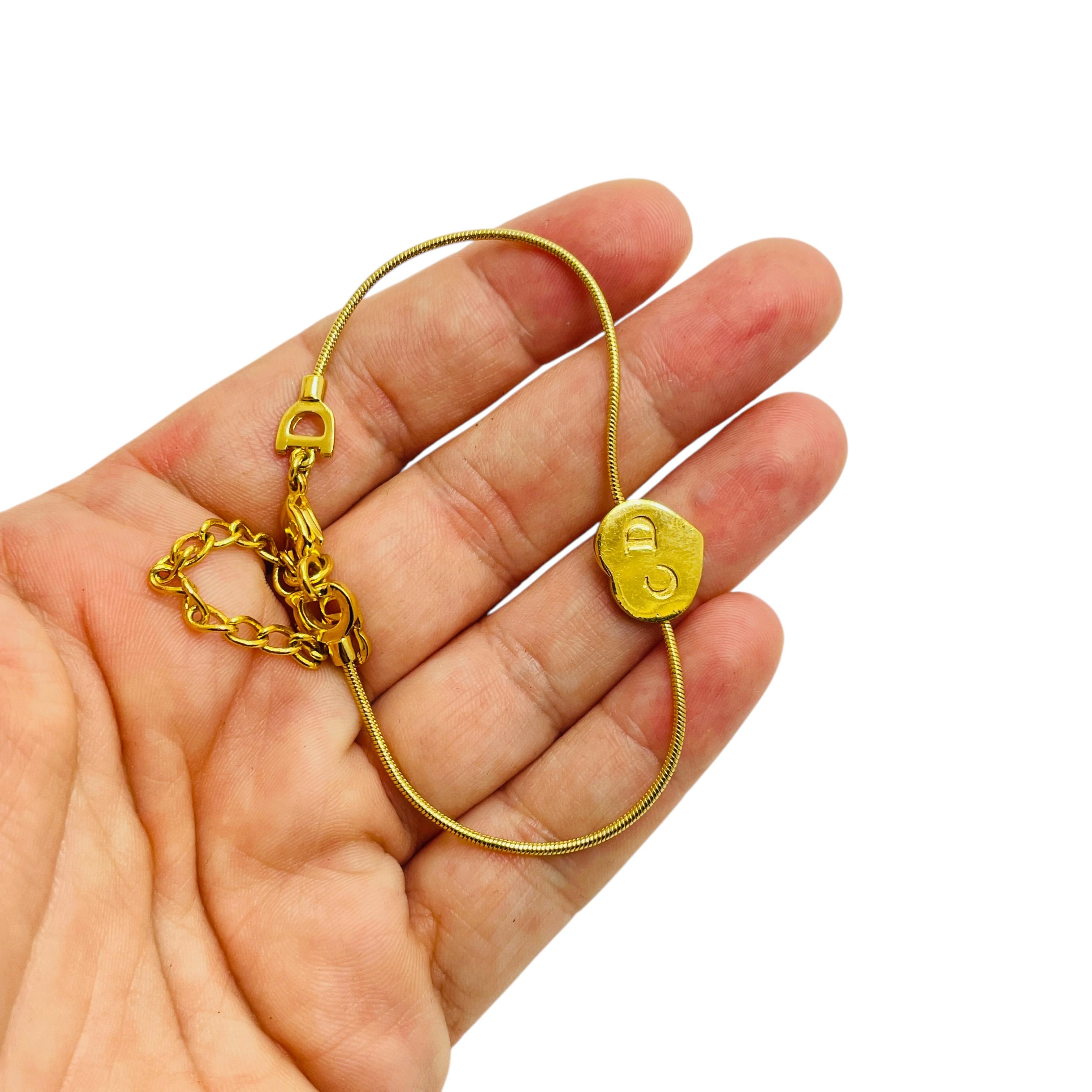 Vintage CHRISTIAN DIOR logo gold plated heart CD logo designer runway bracelet For Sale 1