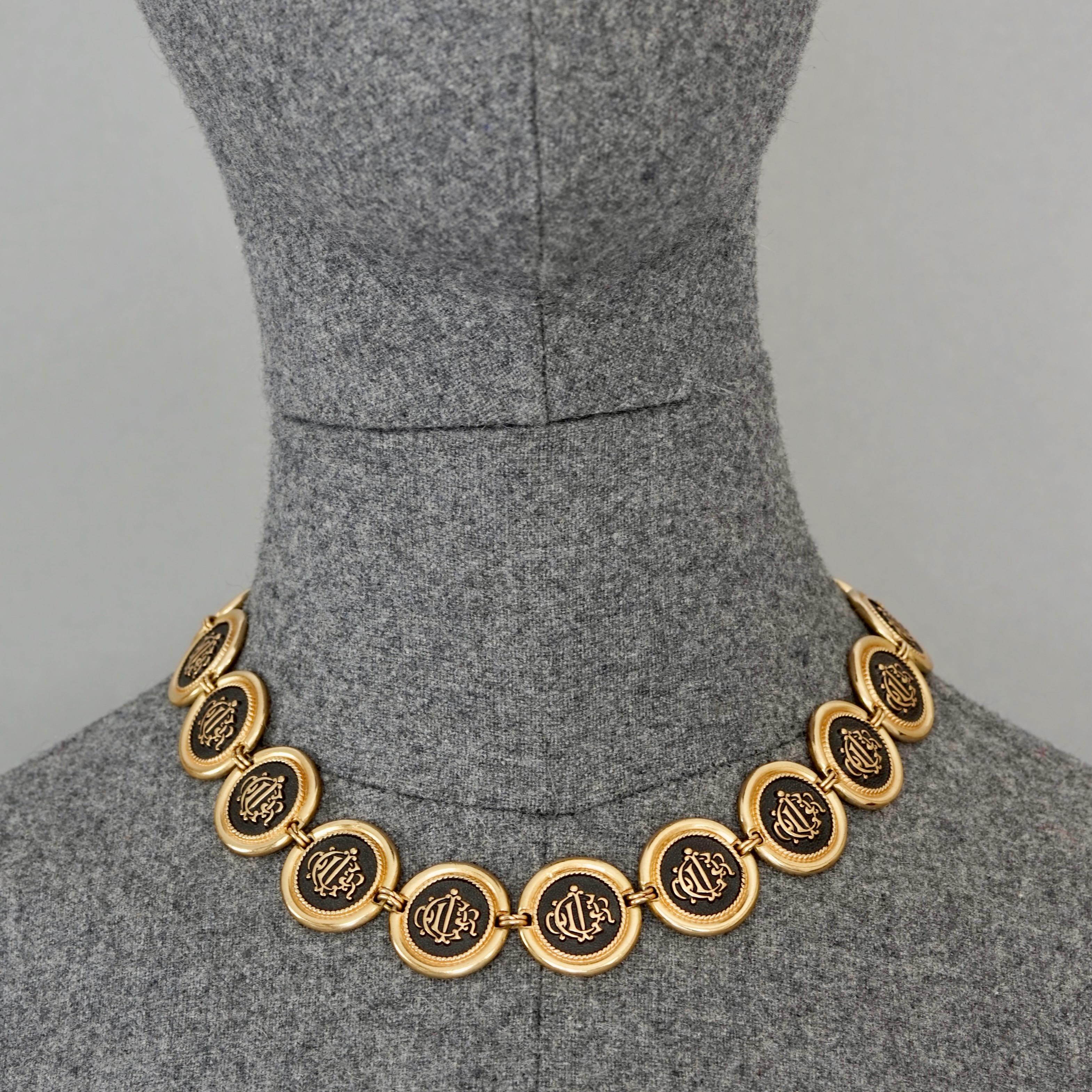 Vintage CHRISTIAN DIOR Logo Insignia Medallion Link Necklace

Measurements:
Height: 0.90 inch (2.3 cm) 
Wearable Length: 17.12 inches until 19.09 inches (43.5 until 48.5 cm) adjustable

Features:
- 100% Authentic CHRISTIAN DIOR.
- Medallion link