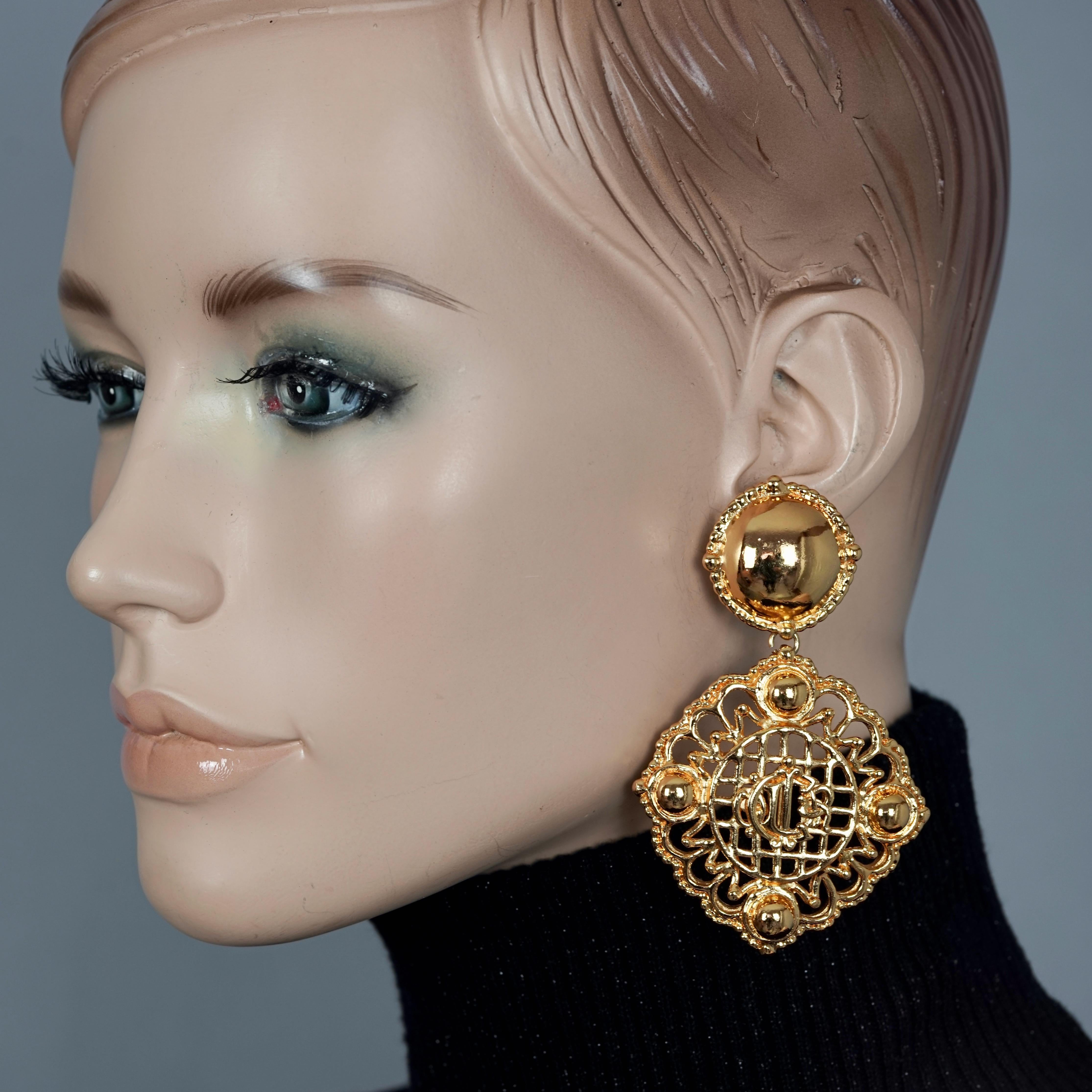 Vintage CHRISTIAN DIOR Logo Insignia Mesh Dangling Earrings

MEASUREMENTS:
Height: 3.15 inches (8 cm) 
Width: 1.96 inches (5 cm) 
Weight per Earring: 33 grams

FEATURES:
- 100% Authentic CHRISTIAN DIOR.
- Dior insignia/ logo dangling earrings.
-