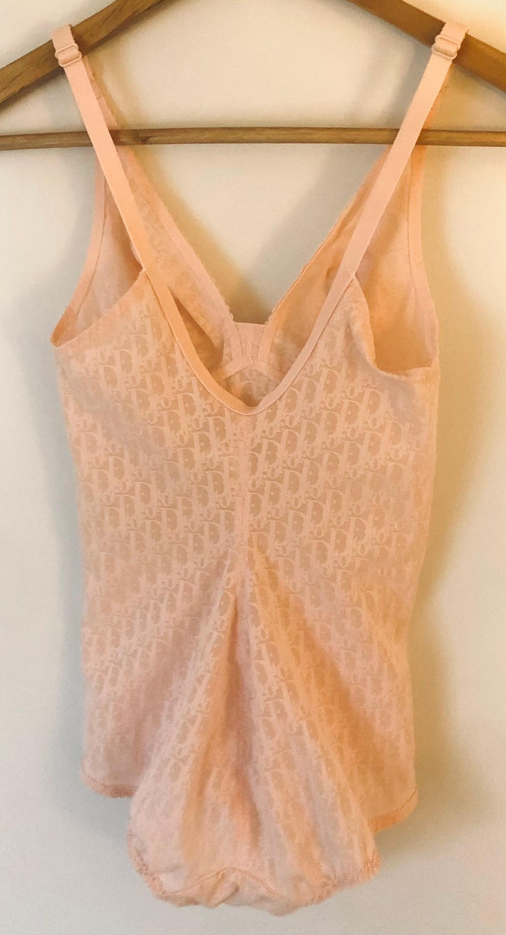 Vintage Christian Dior bodysuit in sheer pink/nude color featuring iconic logos.