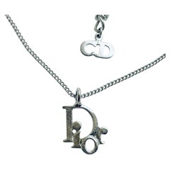 Braccialetto vintage CHRISTIAN DIOR con logo in seta e design da passerella
