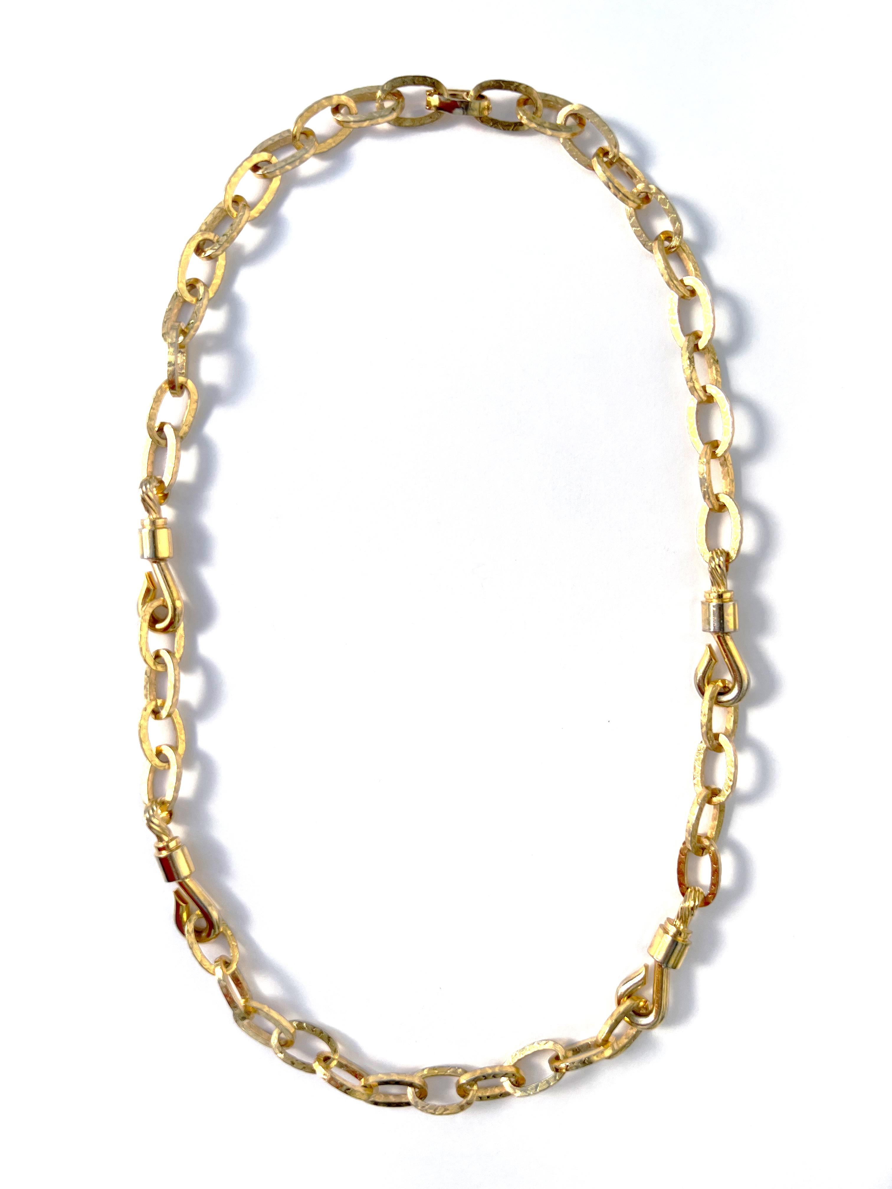 Vintage Christian Dior long chain necklace in gold plate, dated 1972.  This long and substantial heritage necklace features chunky flat-sided oval-shaped chain links with an intricately patterned finish, punctuated at intervals by four jaunty