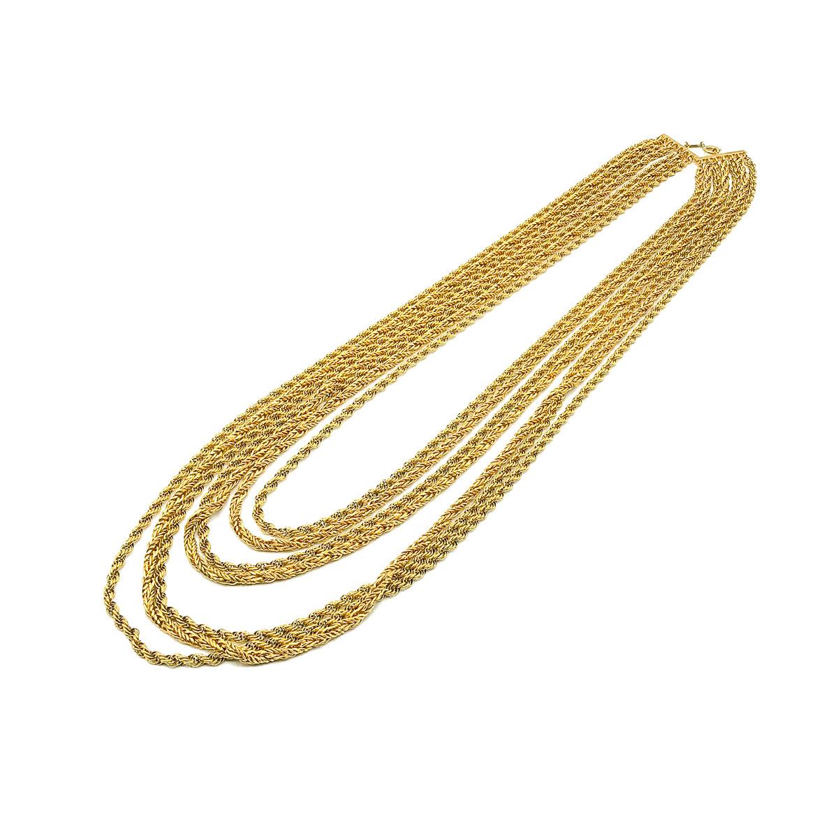 A Vintage Dior Multi Chain Necklace from 1972. Crafted in gold plated metal. Seven lavish rope chains in graduated lengths drop beautifully to create a dramatic bib effect. In very good vintage condition, signed, measuring approx. 64cm on the