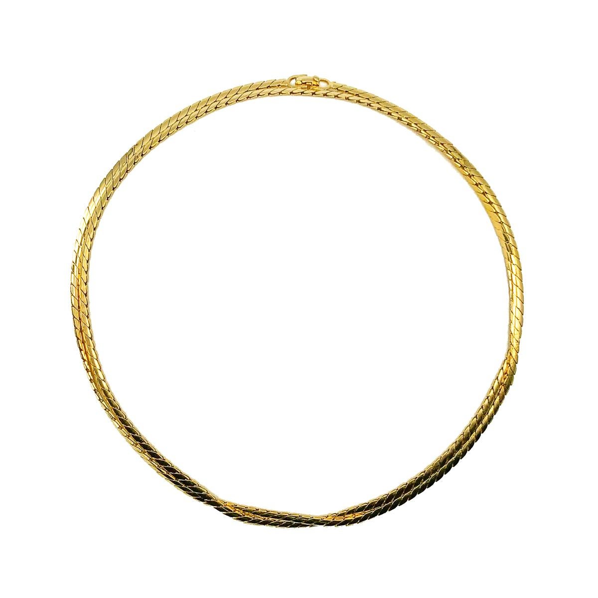 A wonderfully long Vintage Dior Long Snake Chain. Crafted in gold plated metal. Very good vintage condition, signed, 90.5cms. A perfect jewel box staple from the Dior archive that will prove invaluable time and time again. Wear it long and loose or