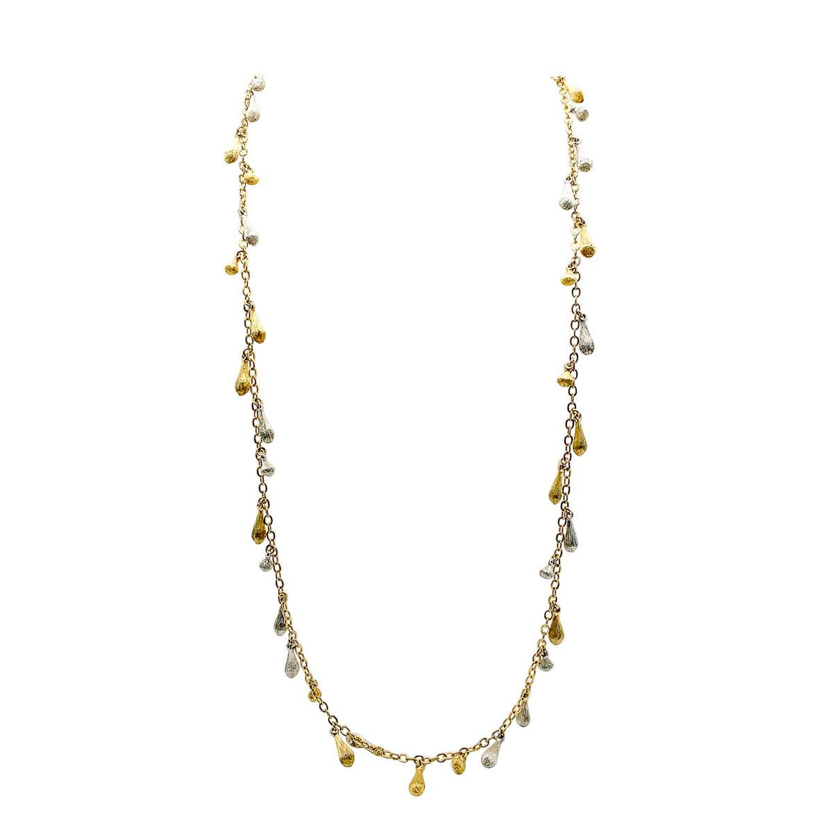 An exquisite modernist Vintage Dior Droplet Necklace. Featuring a gold plated chain adorned with a variety of sizes of delicate textured droplets, each one beautifully fashioned and weighty. Varying droplet sizes remind us of the attention to detail