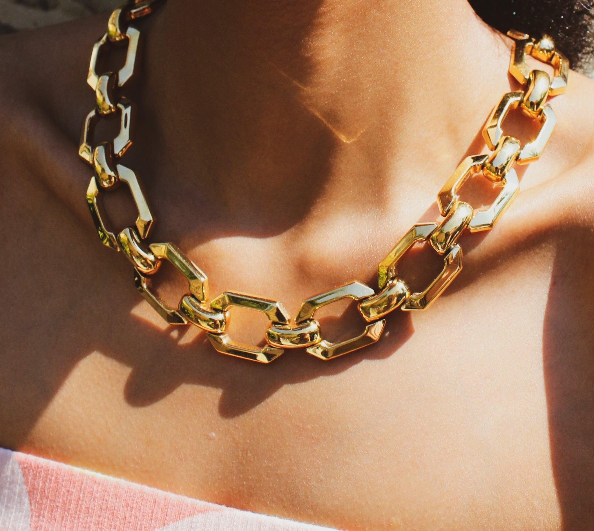 A super cool chunky collar link necklace from the one of the world's most desirable designers - sure to elevate any outfit. Crafted in Germany in the early 80s, this incredible necklace is cast from high quality gold plated metal hexagon links,