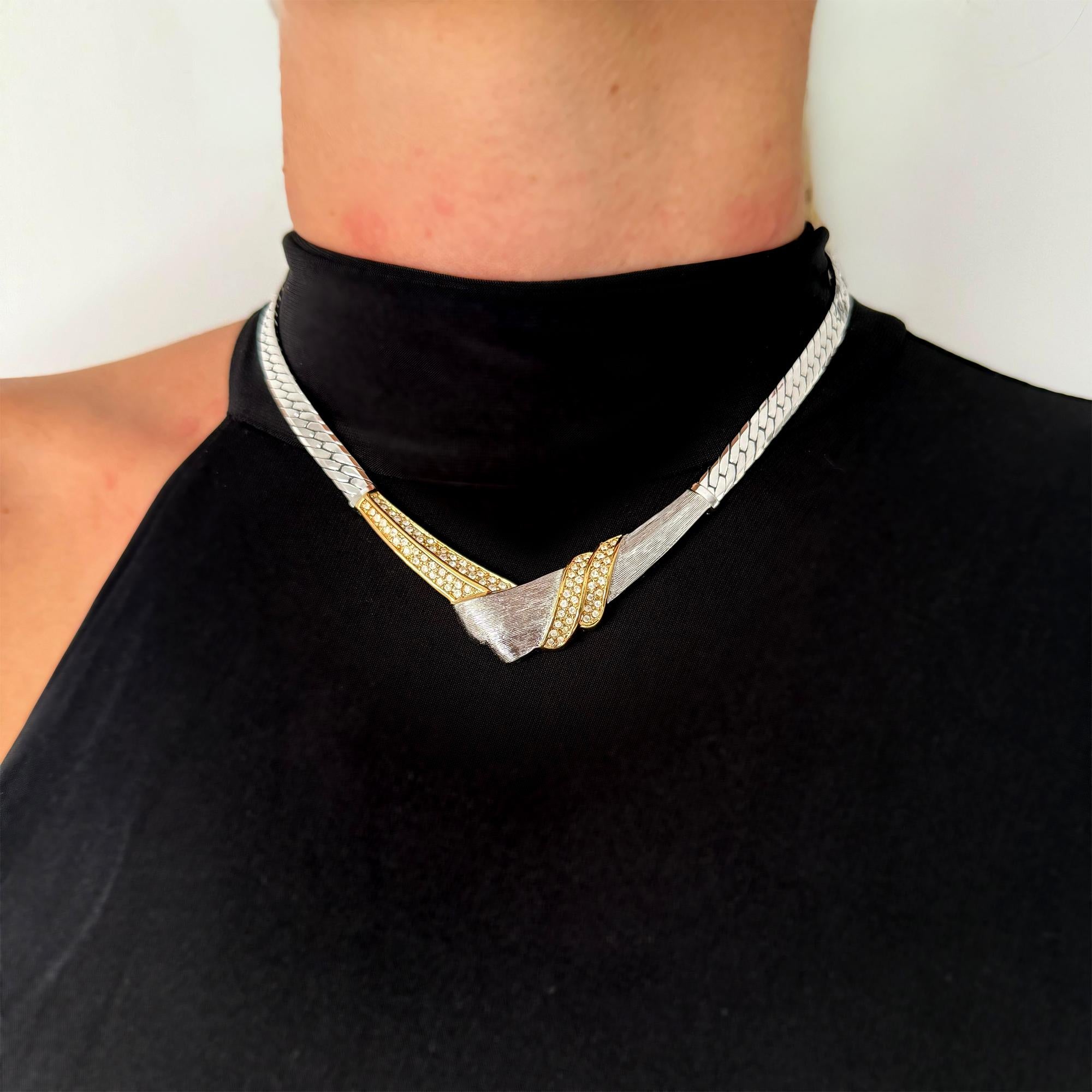A vintage Christian Dior necklace, circa 1980s, crafted in silver-tone and gold-tone metal with sparkling crystal accents. The necklace measures 40cm in length and fastens securely. A genuine piece of Dior vintage costume jewellery, highly