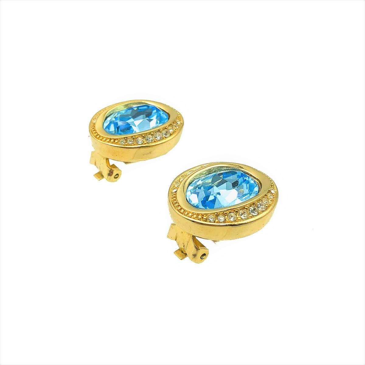 A pair of ultra feminine and very pretty Vintage Dior Aqua Earrings. Crafted in weighty gold plated metal and set with glass crystals. In very good vintage condition. Signed. Approx. 2.2cms. A magical pair of clip on earrings from the House of Dior