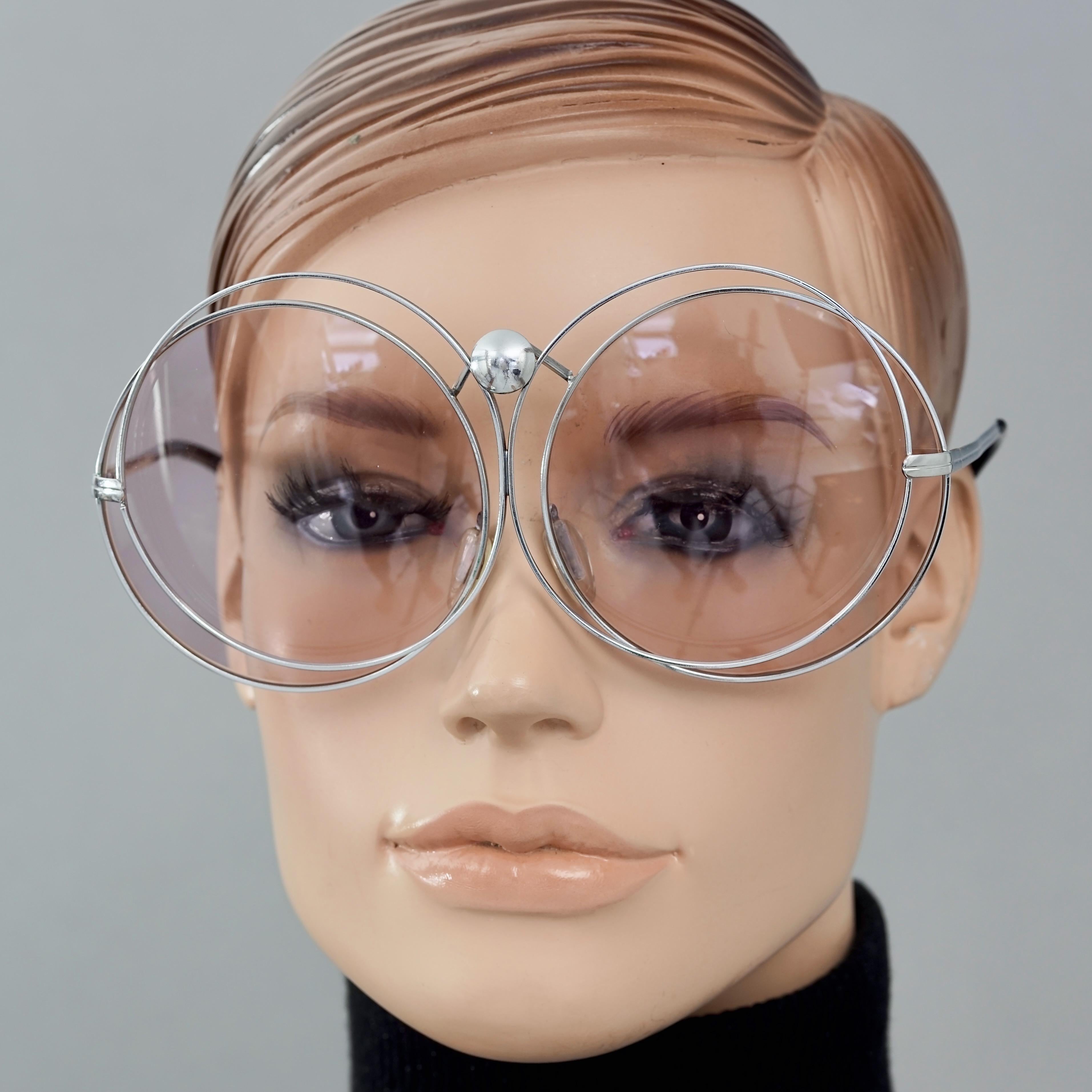 Vintage CHRISTIAN DIOR Oversized Purple Round Interlocked Silver Sunglasses

Measurements:
Height: 2.95 inches (7.5 cm)
Horizontal Width: 6.29 inches (16 cm)
Temples: 4.84 inches (12.3 cm)

Features:
- 100% Authentic Vintage CHRISTIAN DIOR. 
-