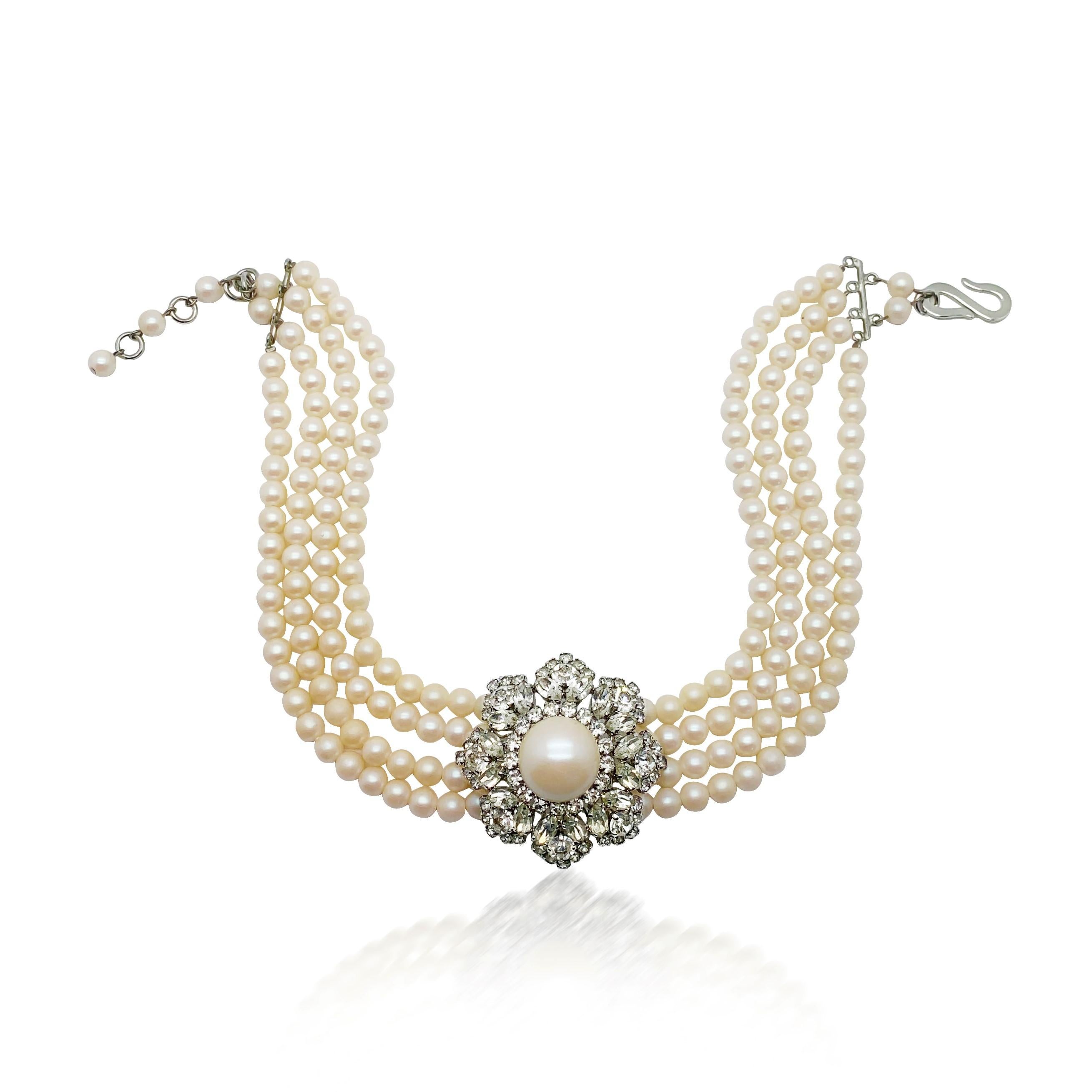 A sublime Vintage Dior Pearl Choker dating to the year 1970. Crafted in rhodium plated metal, claw set fancy cut crystal stones and simulated pearls. Featuring a stunning central stylised flower design intricately set with an array of sparkly fancy
