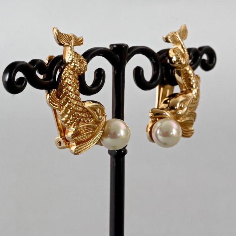 E17339MOP Chubby Mother Of Pearl Fish Earrings with Sapphire Eye