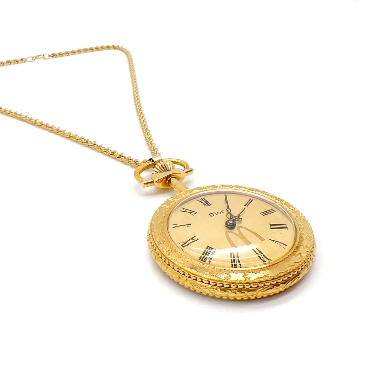 A Vintage Christian Dior Pendant Watch Necklace bearing the brands of both Dior and McDonalds. An almost incredulous brand pairing of fast-food and fashion megabrands, McDonalds & Dior. So much so, it's novelty value and intriguing provenance drew
