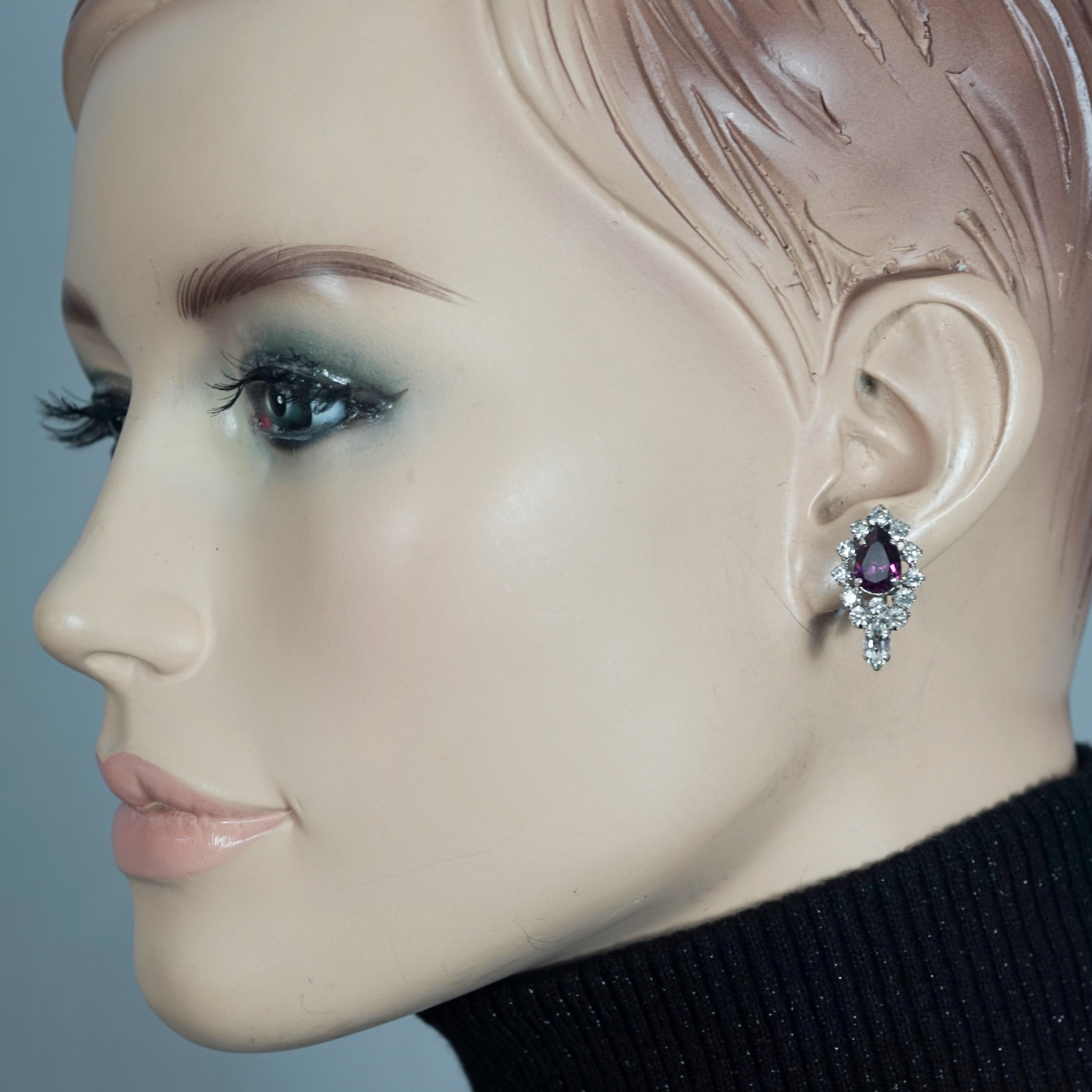 Vintage CHRISTIAN DIOR Purple Amethyst Rhinestone Earrings

Measurements:
Height: 0.98 inch (2.5 cm)
Width: 0.55 inch (1.4 cm)
Weight per Earring: 3 grams

Features:
- 100% Authentic CHRISTIAN DIOR.
- Purple amethyst pear and clear rhinestones