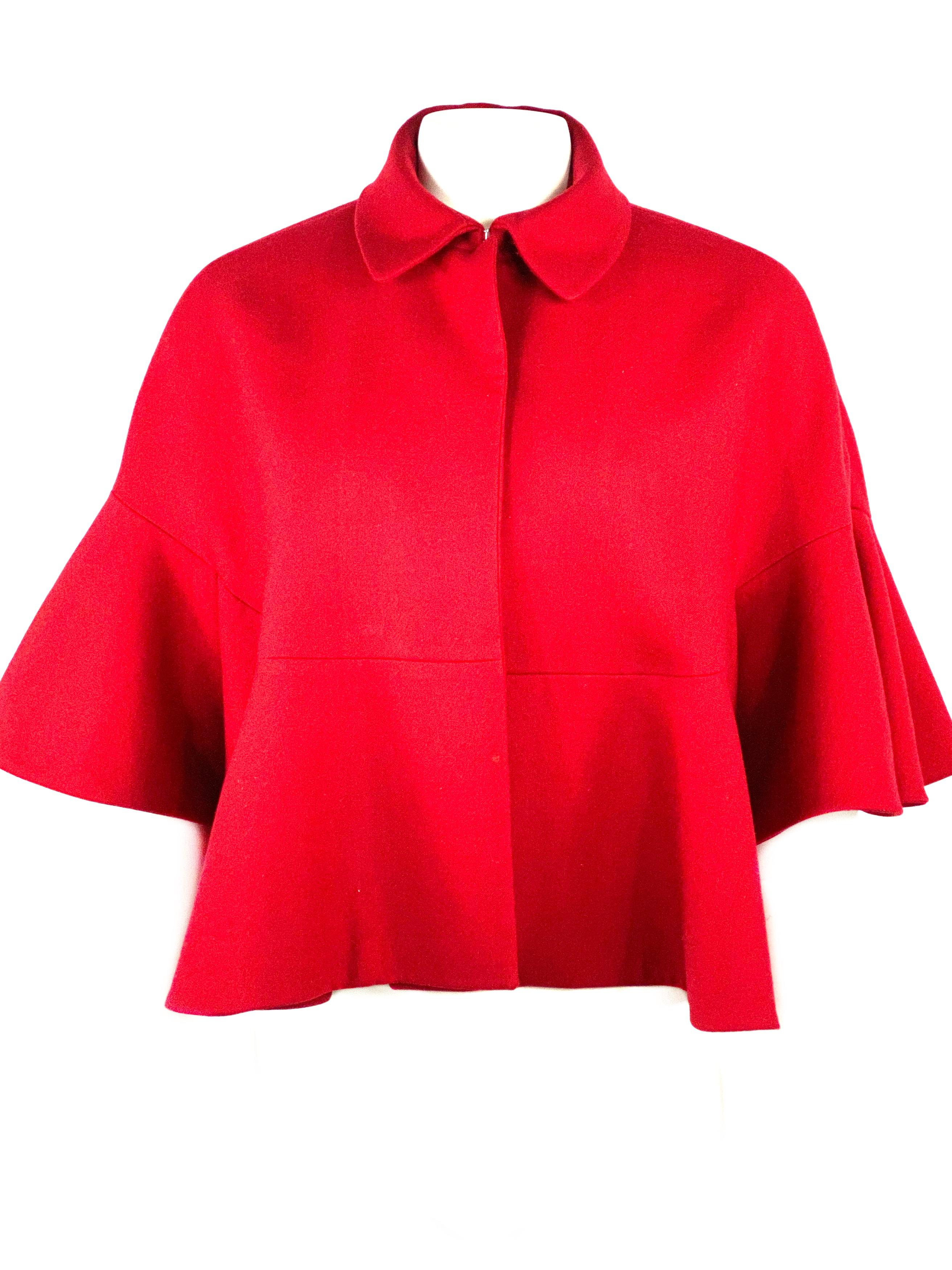 Vintage Christian Dior Red Wool Cape Poncho Size 8

Product detail:
Size US 8
100% Wool
Silver tone front hook closure
Featuring ½ length flare sleeves
Loose fit 
Made in France
