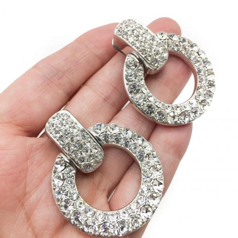 The most magnificent vintage Dior rhinestone hoop earrings. Dating to the 1990s these are the perfect designer statement earring. Crafted in very high quality rhodium plated metal and set with an abundance of Swarovski crystals or rhinestones. The