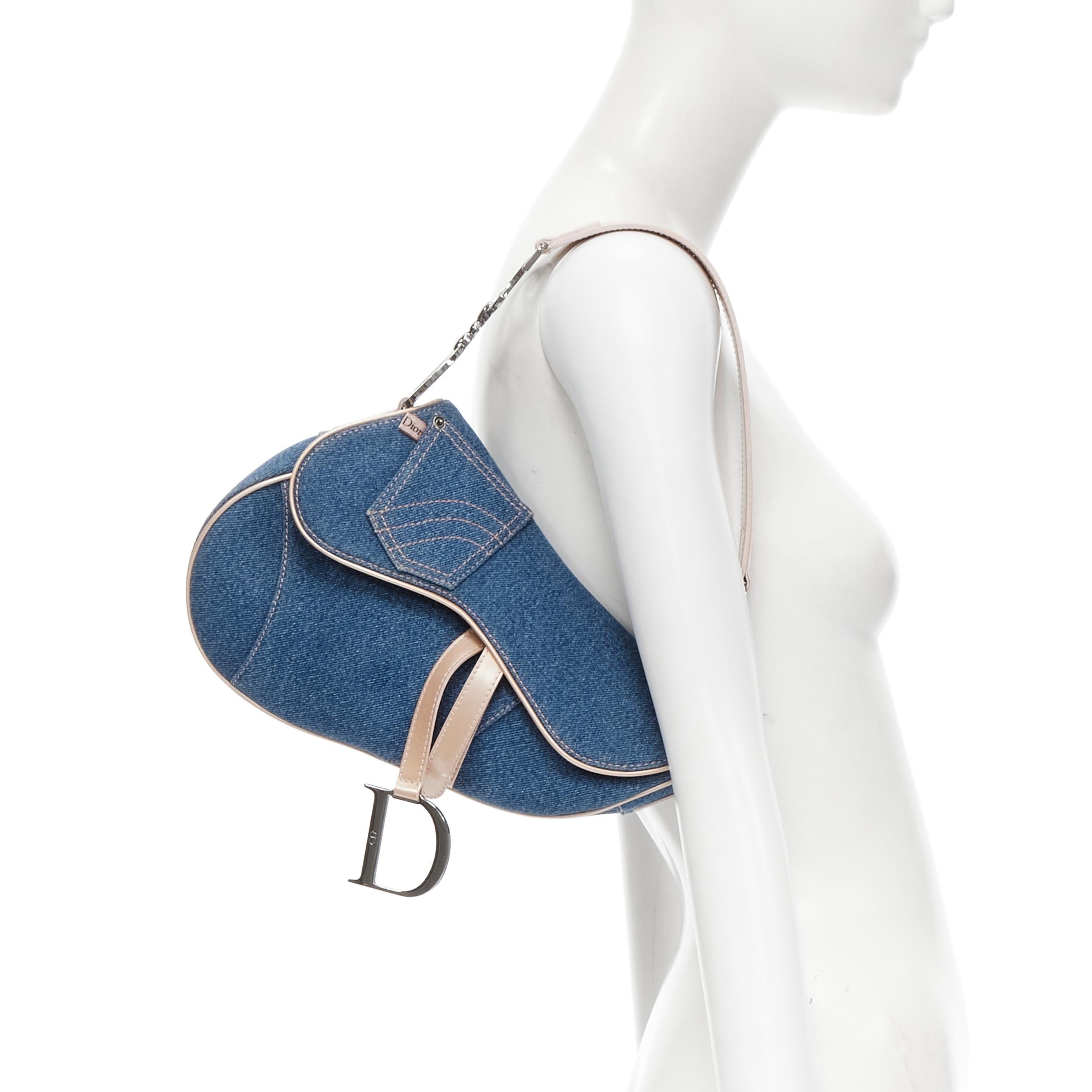 vintage CHRISTIAN DIOR Saddle blue denim jean pocket beige patent shoulder bag 
Reference: CELG/A00005 
Brand: Christian Dior 
Designer: John Galliano 
Model: Saddle bag 
Material: Denim 
Color: Blue 
Pattern: Solid 
Closure: Magic tape 
Extra