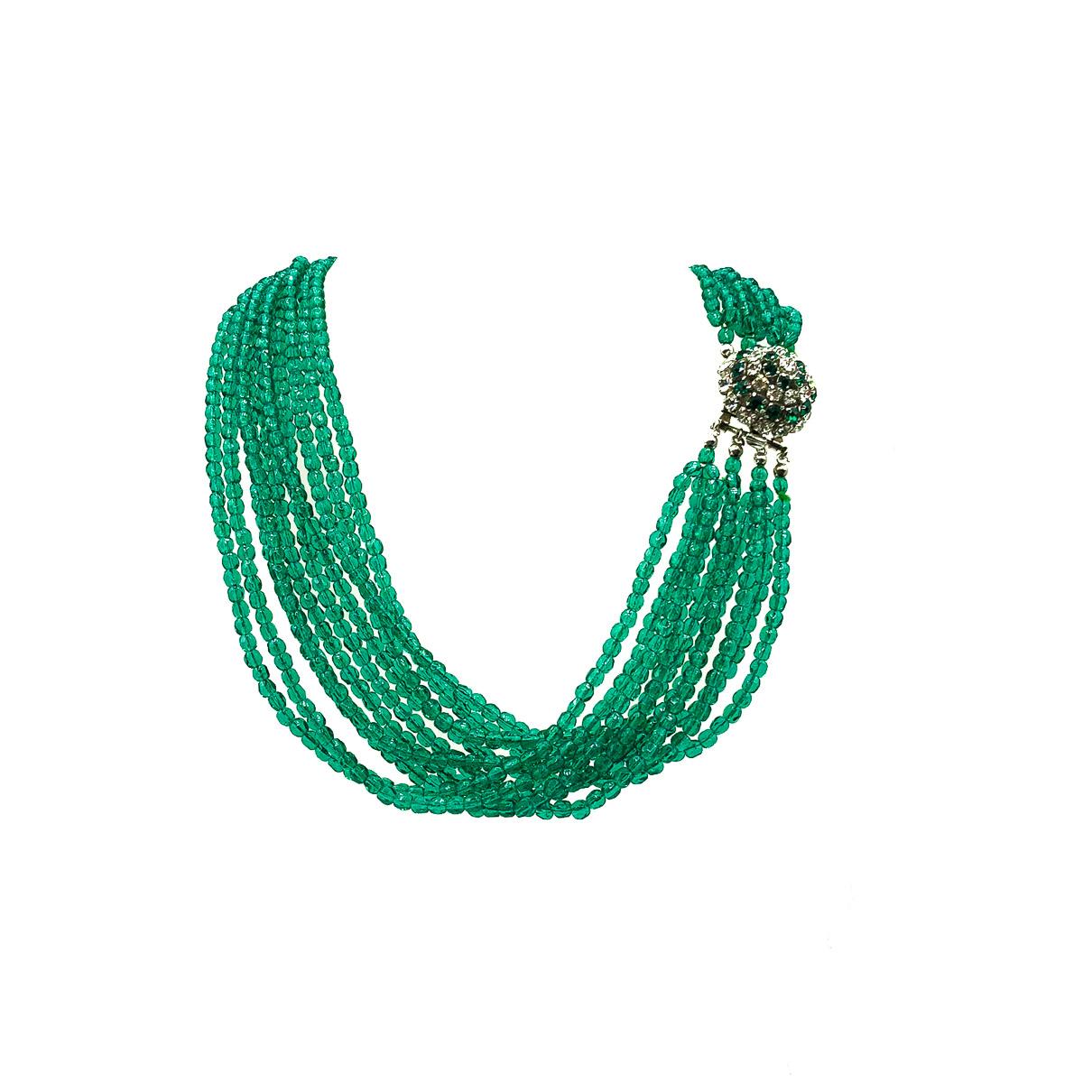 A very special Vintage 1964 Dior Torsade Collar hailing from the era of Marc Bohan at the Head of Dior's design. Crafted with hundreds and hundreds of emerald green glass faceted beads creating four triple strands for that timelessly chic torsade
