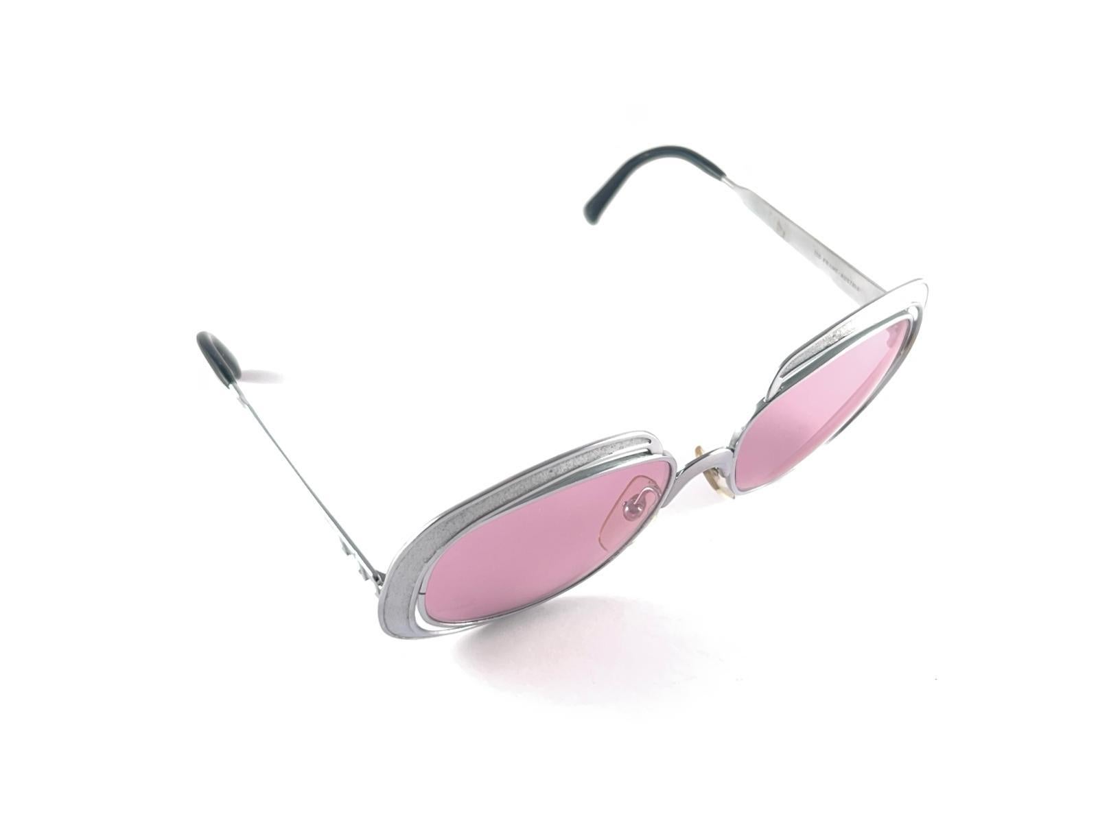Vintage Christian Dior Sunglasses. 
Oversized Silver Rough Finish Frame.
Spotless Light Pink Lenses.
This Item May Show Light Sign Of Wear Due To Storage.



Made In Austria



Front                                       14.5 Cms
Lens Height        