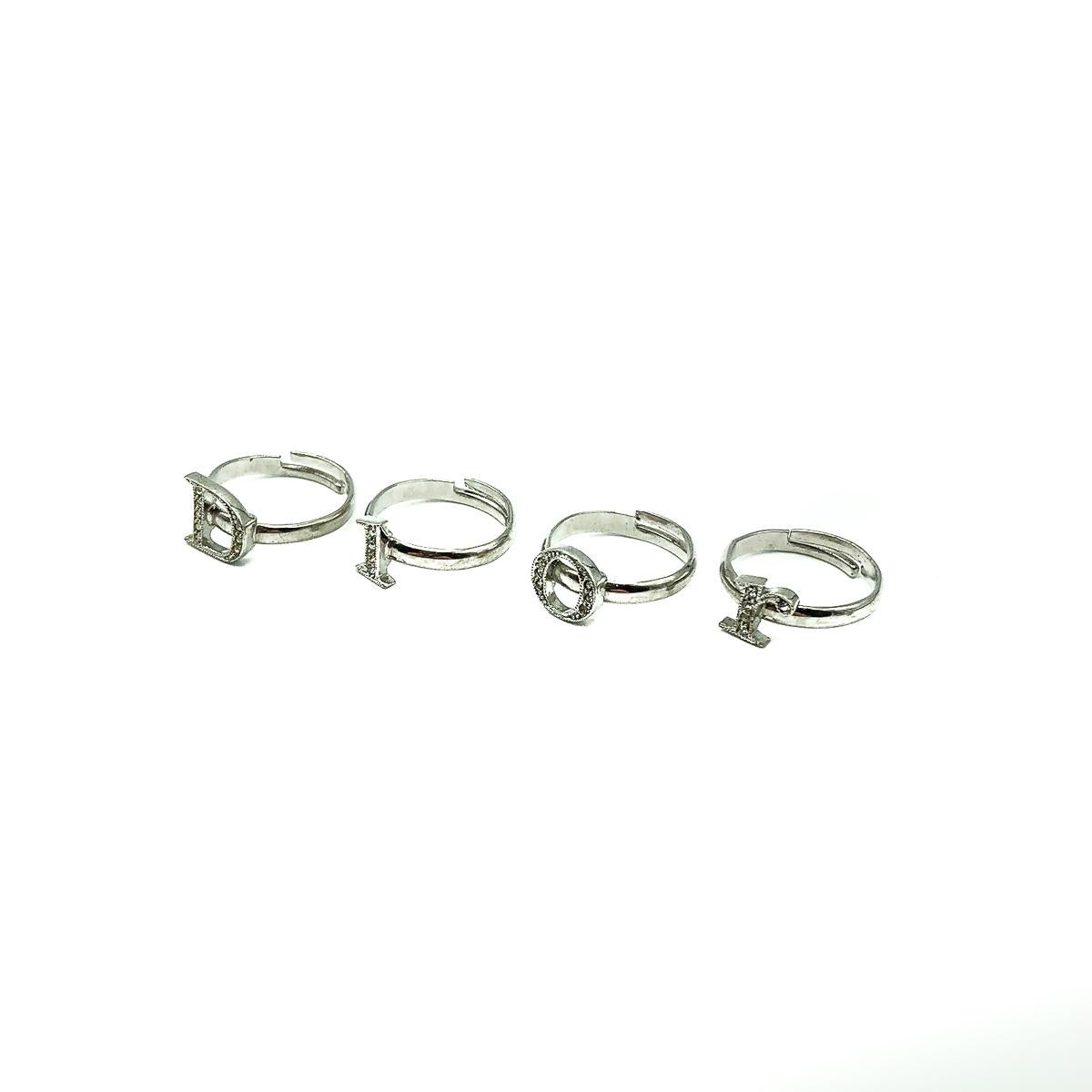 A divine set of Vintage Dior Stacking Rings. Crafted in rhodium plated metal and crystals. Four rings each depicting a letter spelling out the iconic House. These are an original design and not converted from necklace charms. In very good vintage
