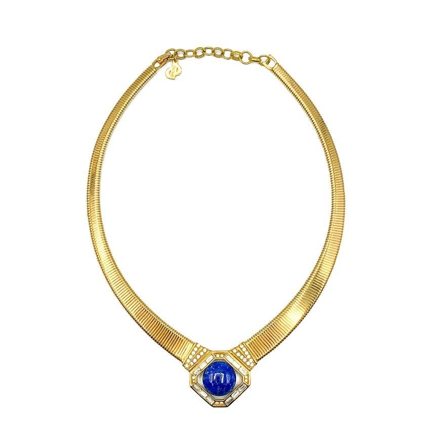 A striking Vintage Dior Lapis Necklace. Featuring a wonderfully lavish gold plated collar with a central octagonal panel adorned with fancy cut crystals and large round cabochon deep blue stone in the manner of lapis lazuli. In excellent vintage