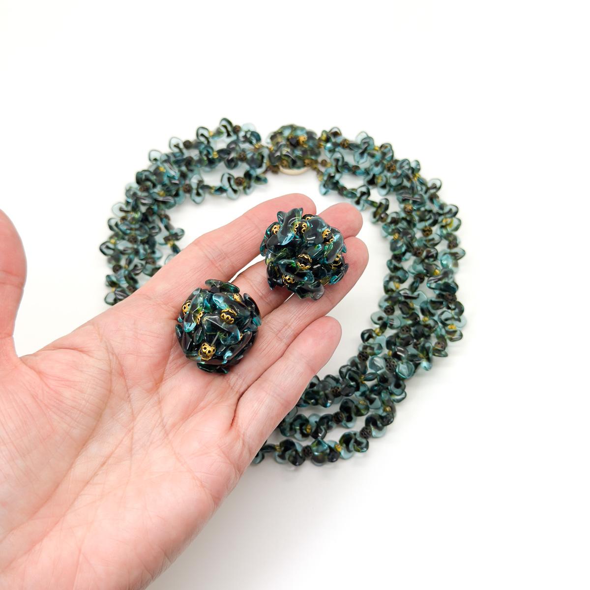 A sublime Vintage Christian Dior Teal Necklace and Earring set crafted by the iconic couture House in 1967 when Marc Bohan was at the helm of the House design. Exquisite detail. Wing shaped handmade teal and chocolate art glass pieces adorn the