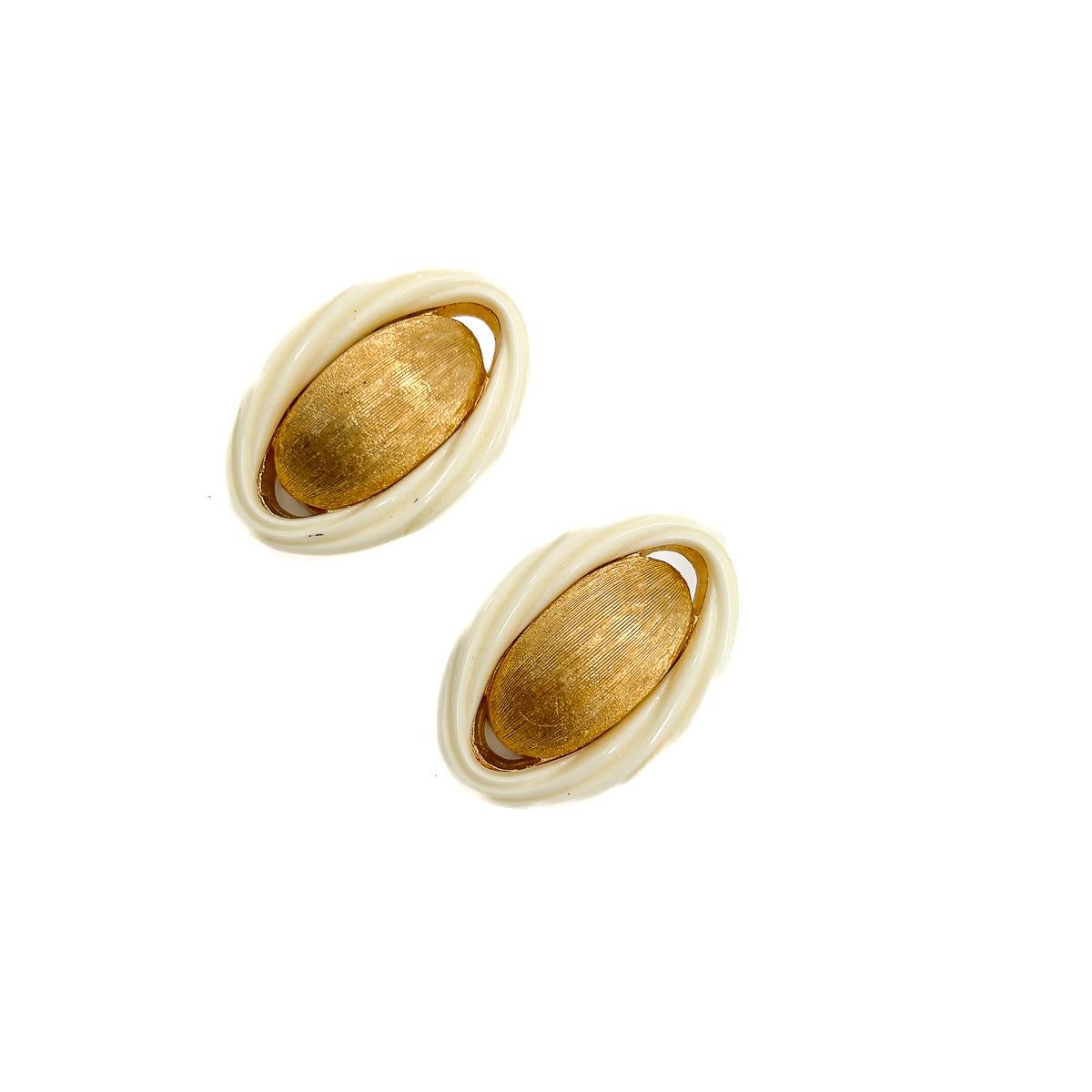 An eternally stylish pair of Vintage Dior Twist Earrings. The perfect jewel box hero. Team gold and cream with pale hues for the chicest of accessories or contrast with deeper shades for a dramatic effect. Exquisitely made heritage from the House of