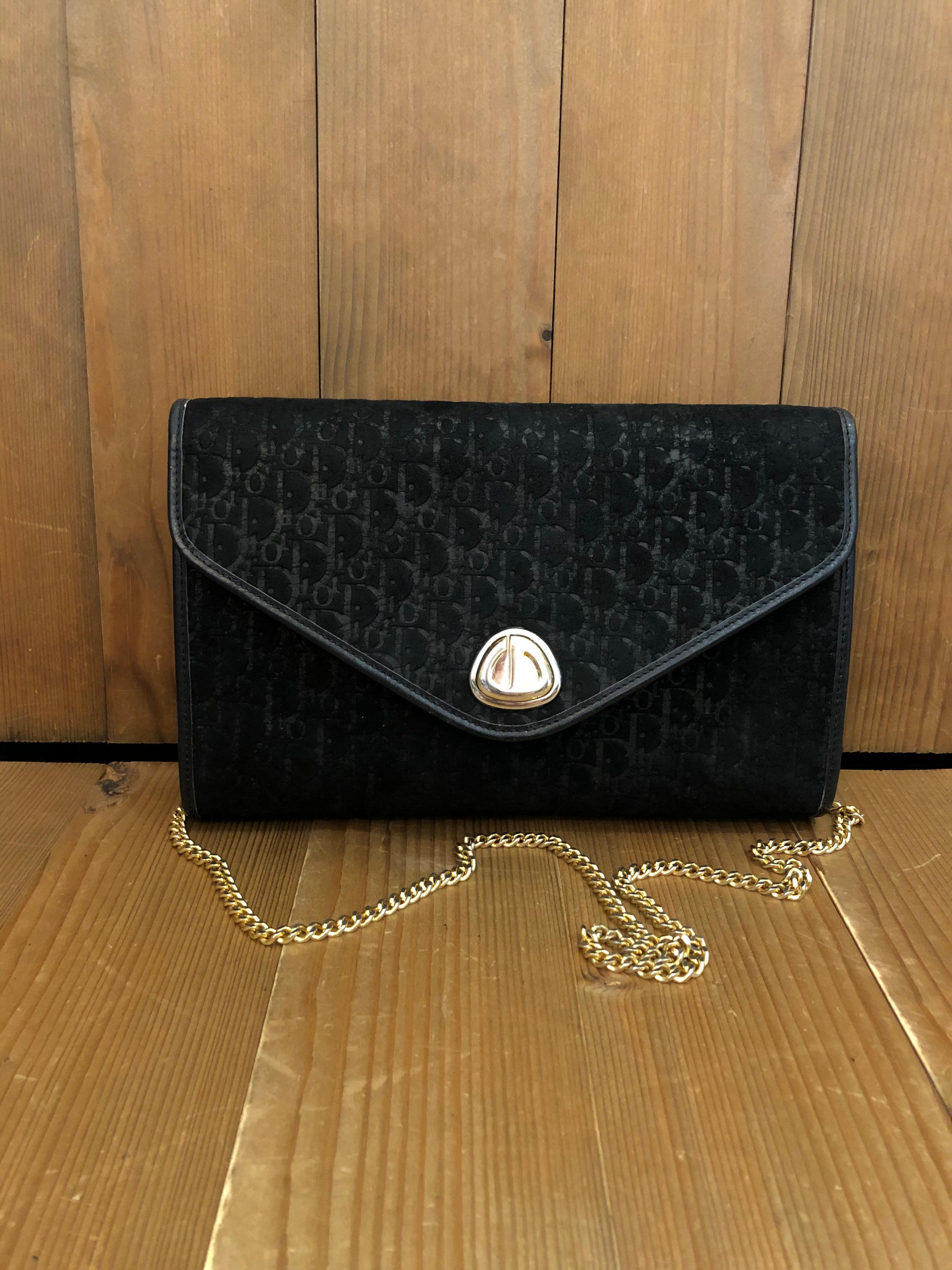 Vintage Christian Dior chain bag in trotter-embossed black suede leather featuring black and white trotter jacquard. The gold toned chain lets you wear this bag double-chained or single-chained.  Made in France. Measures 10 x 6 x 1.75 Chain drop 17