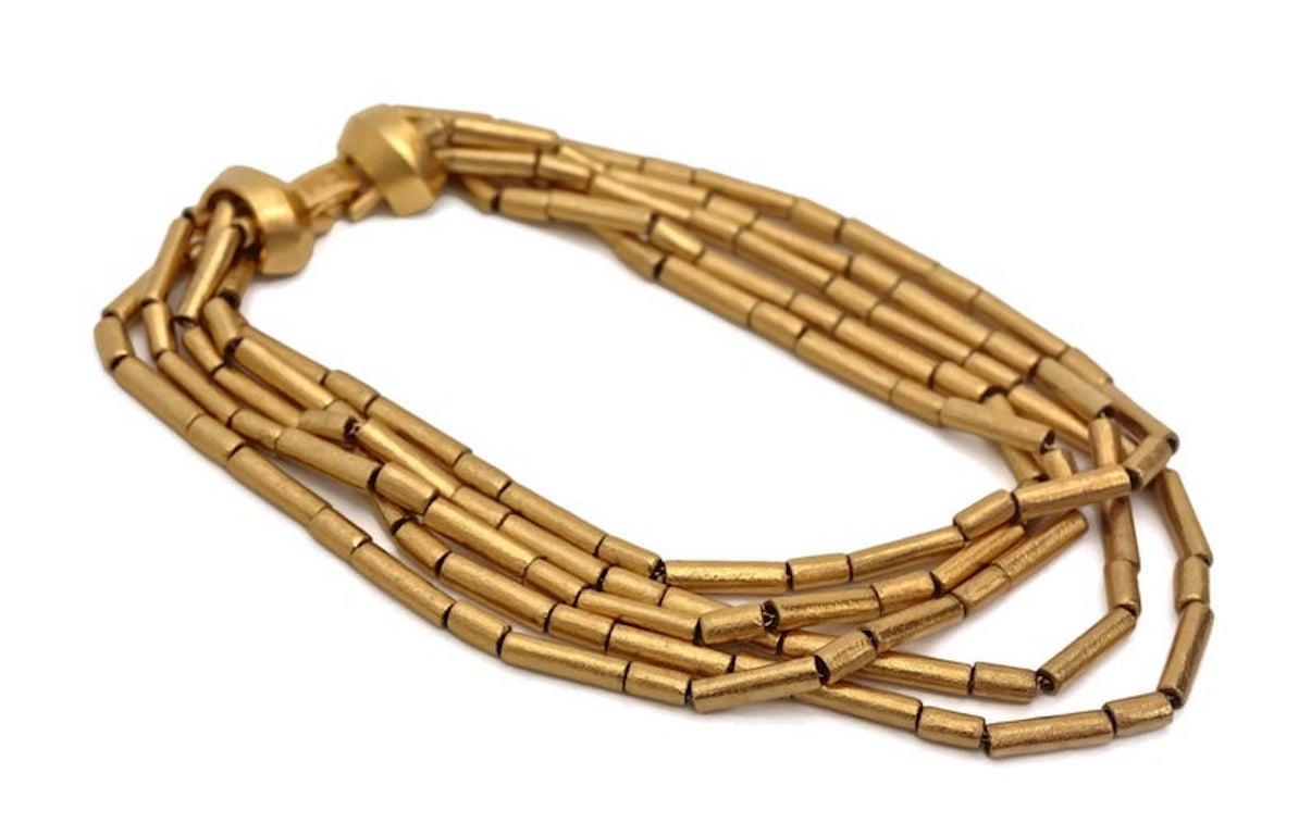 Vintage CHRISTIAN DIOR Tubular Multi Layered Choker Necklace

Measurements:
Wearable Length: 16 4/8 inches

Features:
- 100% Authentic CHRISTIAN DIOR.
- 5 layers of textured tubular chains.
- Signed DIOR on the fold over closure.
- Has some weight