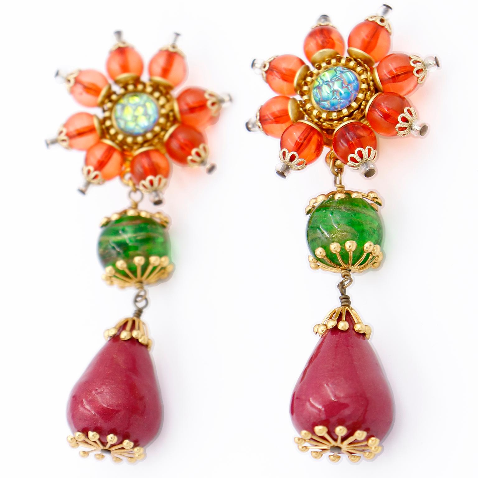 We love vintage Christian Lacroix jewelry and these earrings are incredible! These stunning Christian Lacroix 1990's statement earrings are in gorgeous shades of orange, green, and dark magenta with gold and clear details. These colorful resin
