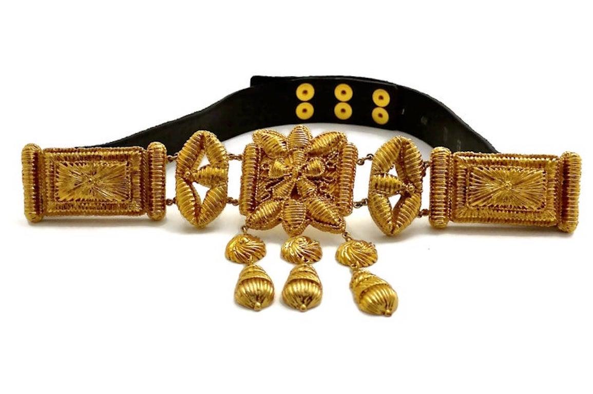 Vintage CHRISTIAN LACROIX Byzantine Mogul Belt

Measurements:
Buckle Height:  5.11 inches (13 cms)
Buckle Width: 6.3 inches (16 cms)
Wearable Length: 26.37 inches (67 cm) to 28.34 inches (72 cms)

Features:
- 100% Authentic CHRISTIAN LACROIX.
-