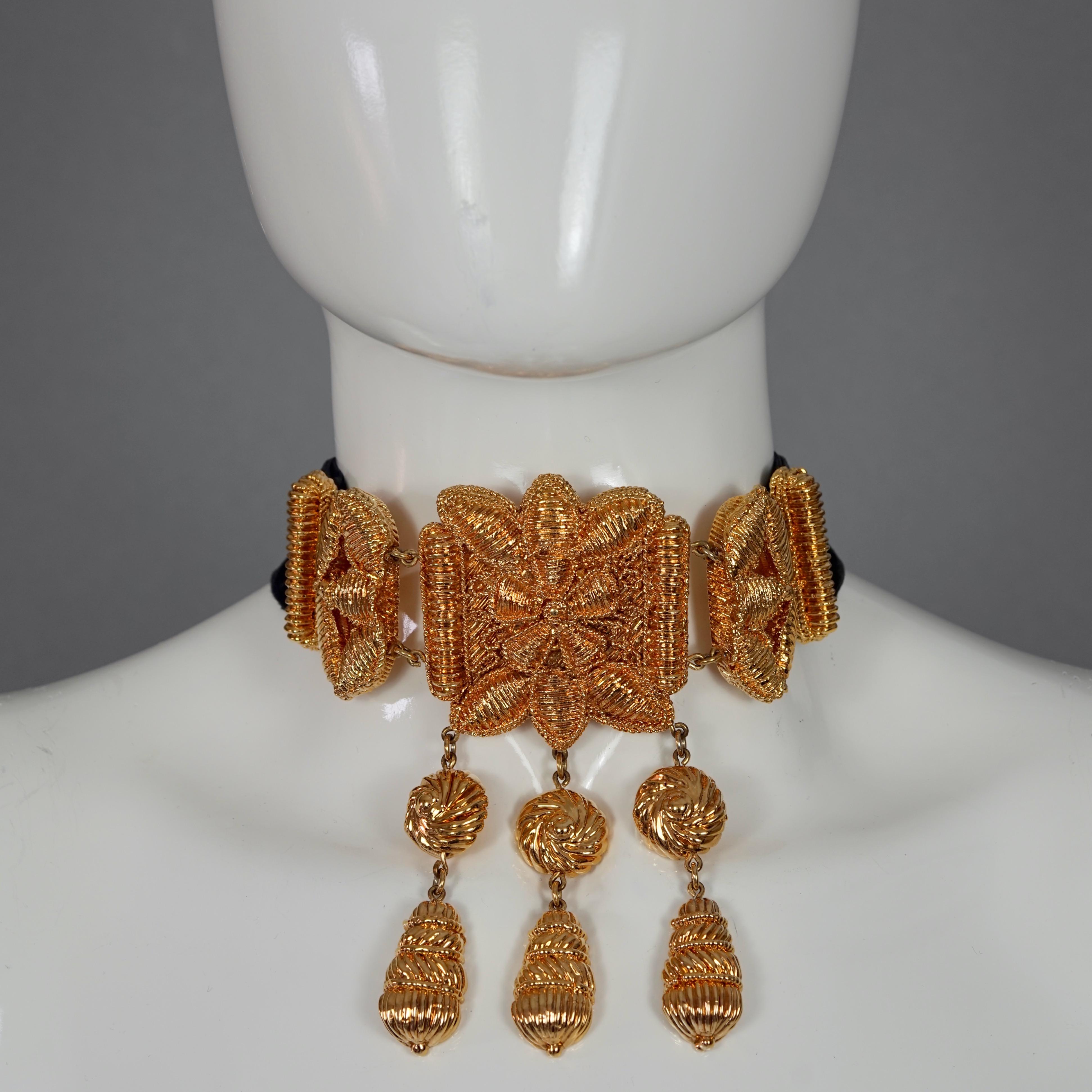 Vintage CHRISTIAN LACROIX Byzantine Opulent Choker Necklace

Measurements:
Buckle Height:  4.92 inches (12.5 cm)
Buckle Width: 5.51 inches (14 cm)
Strap Height: 1.45 inches (3.7 cm)
Wearable Length: 33.85 inches (86 cm) 

Features:
- 100% Authentic